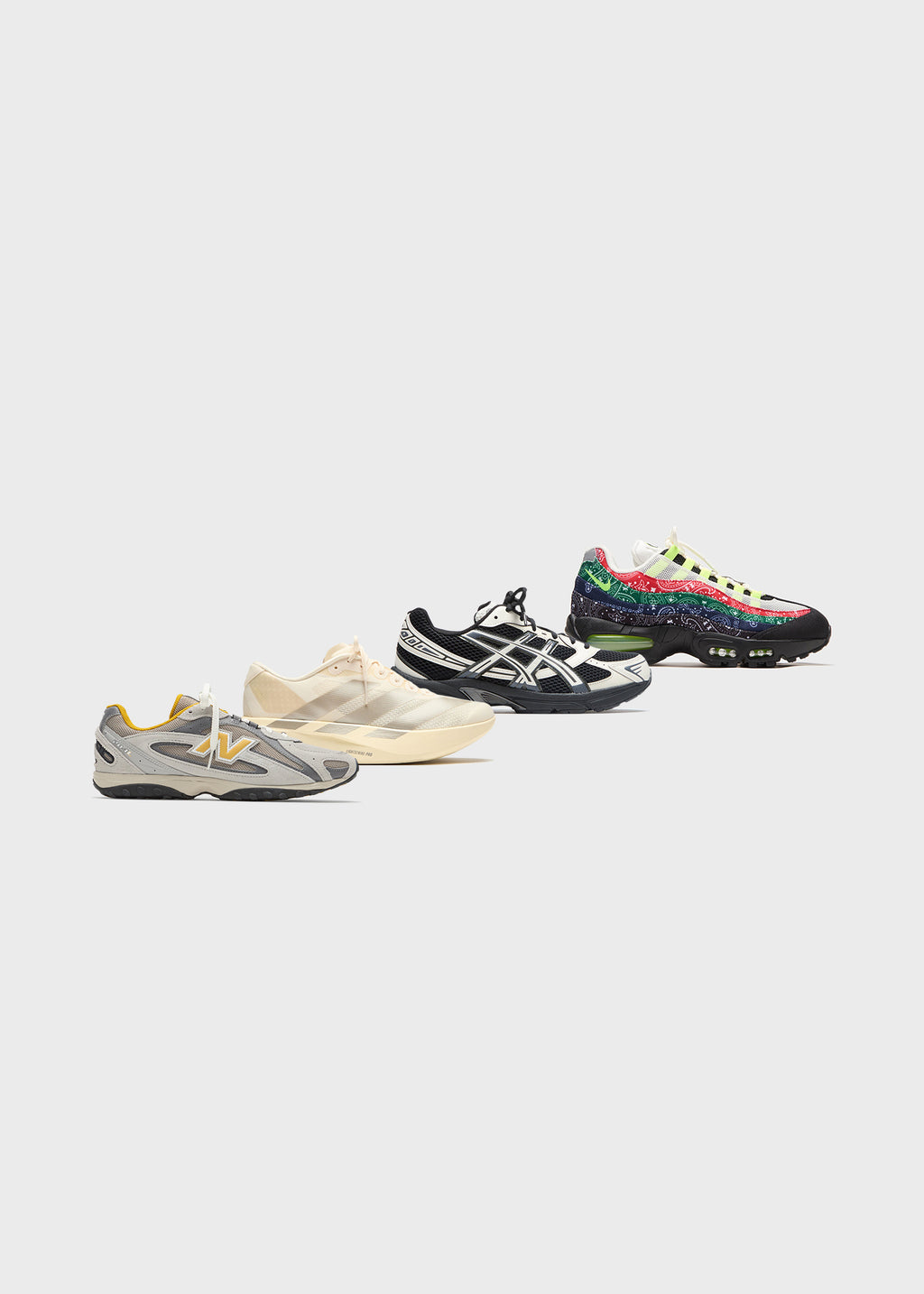 Four sneakers arranged diagonally: grey New Balance, cream adidas, black Asics Gel and multicolor Nike Air Max 95 on white
