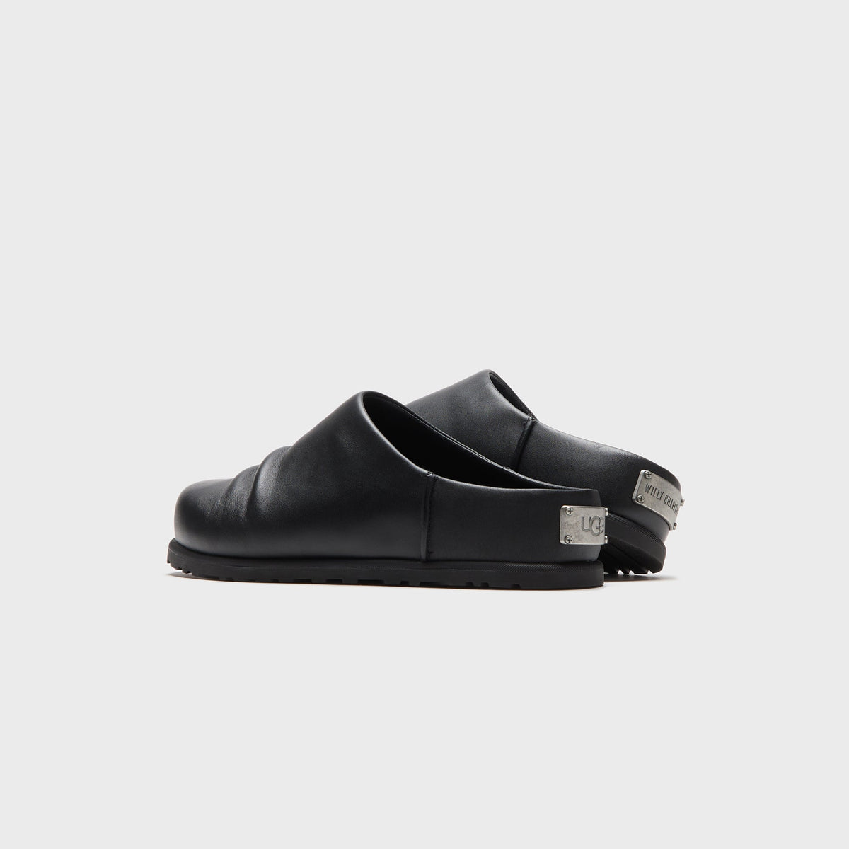 UGG x Willy Chavarria Otzo Clog in Black leather, rear view showing the UGG and Willy Chavarria branded heel tabs