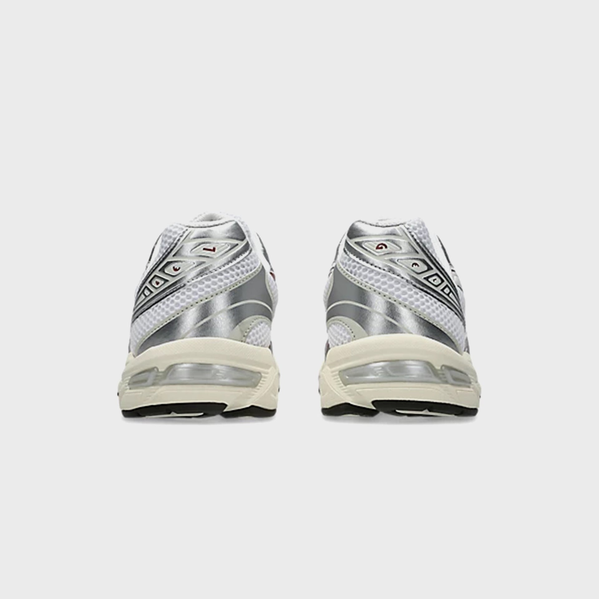 ASICS GEL-1130 in White and Rusted Rock, back heel view showing silver metallic heel counters and visible gel unit