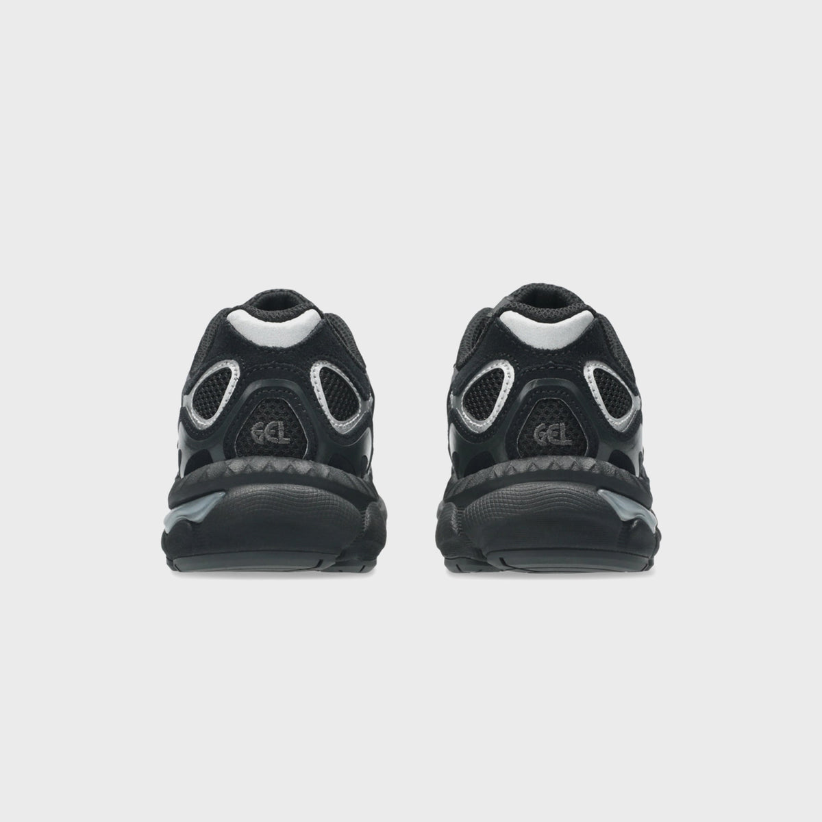 ASICS PS GEL-NYC black and silver sneakers, rear view of pair with GEL heel window detail