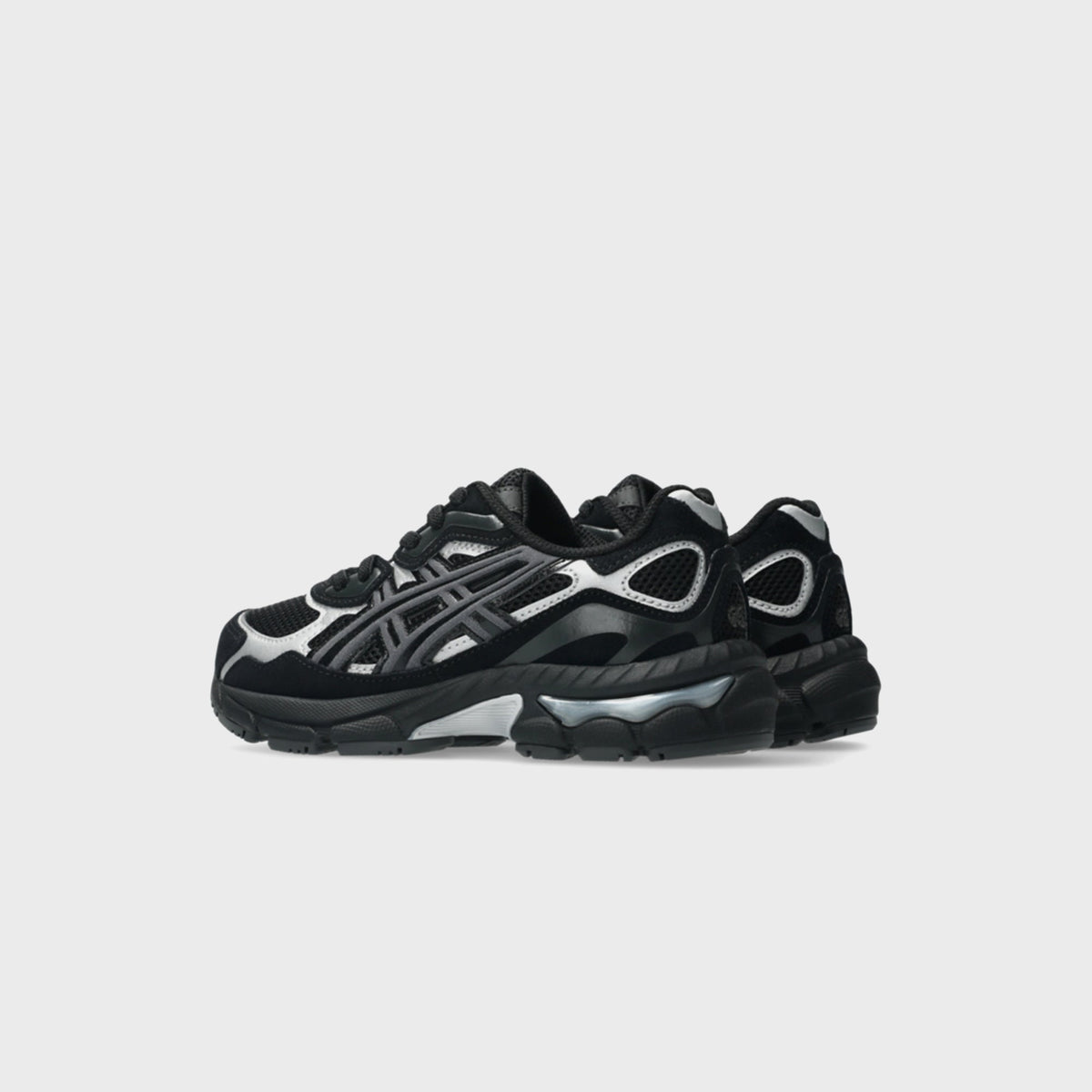 ASICS PS GEL-NYC black and silver sneakers, angled side view showing GEL cushioning in the midsole