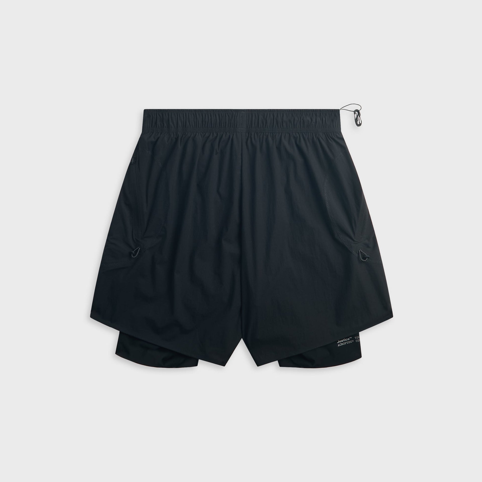 Back of the black Satisfy Rippy Cordura trail short showing the elastic waistband, curved pockets and layered liner