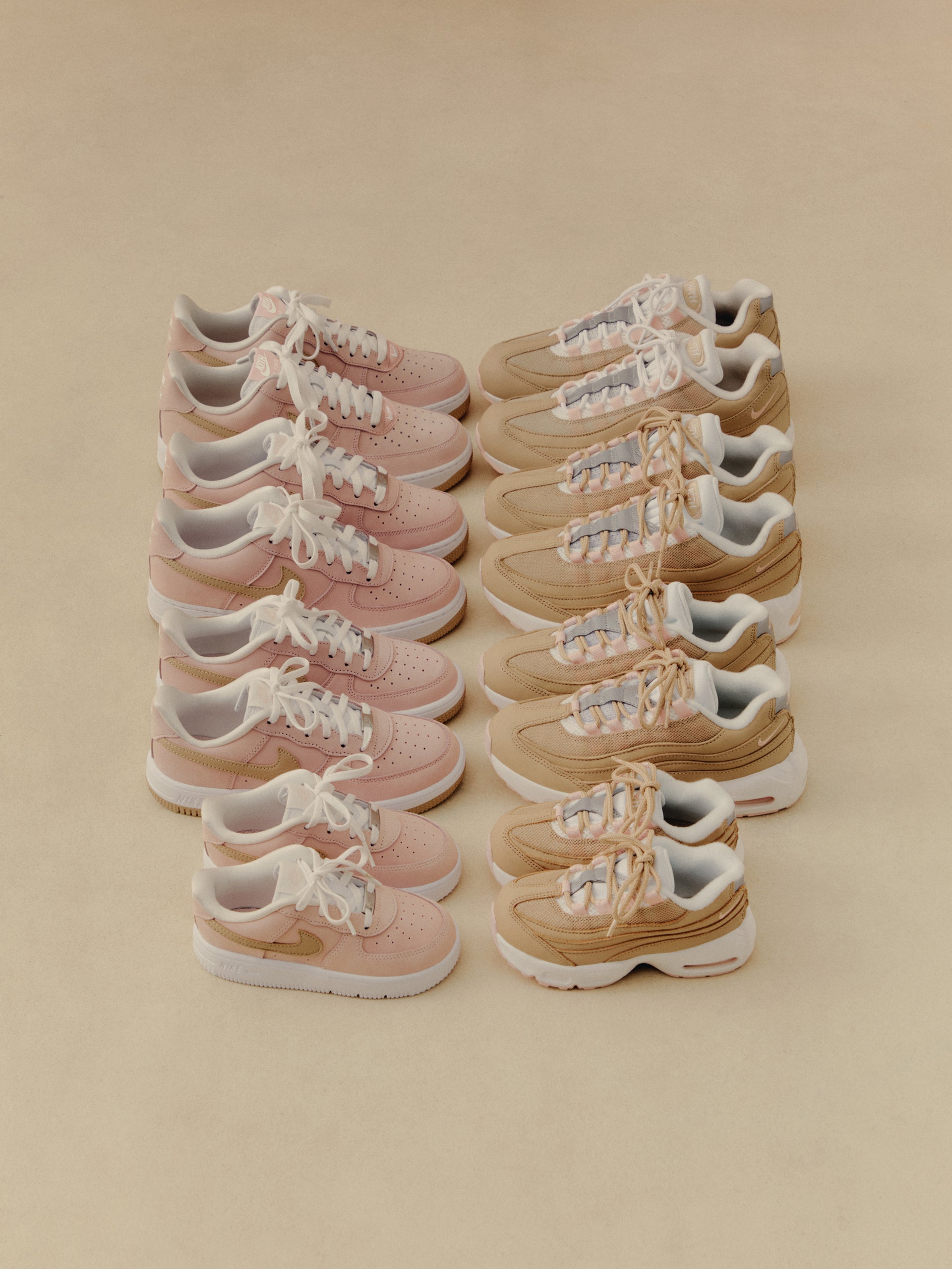Kith display of Nike Air Force 1 in pink and Air Max 95 in tan arranged in rows on a beige backdrop