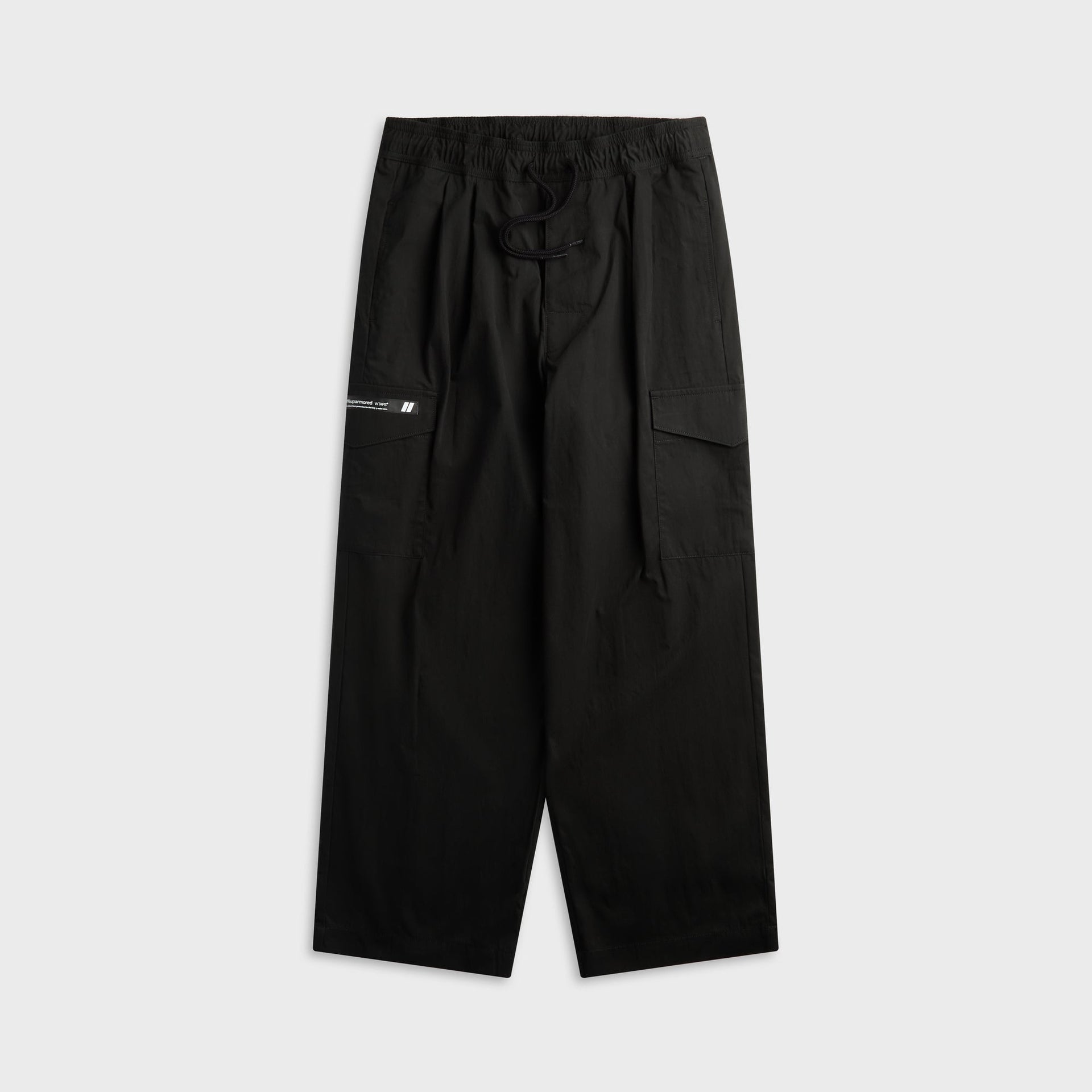 WTAPS MILT2602 black nyco weather trouser with drawstring waist and cargo pocket, front view, flat lay