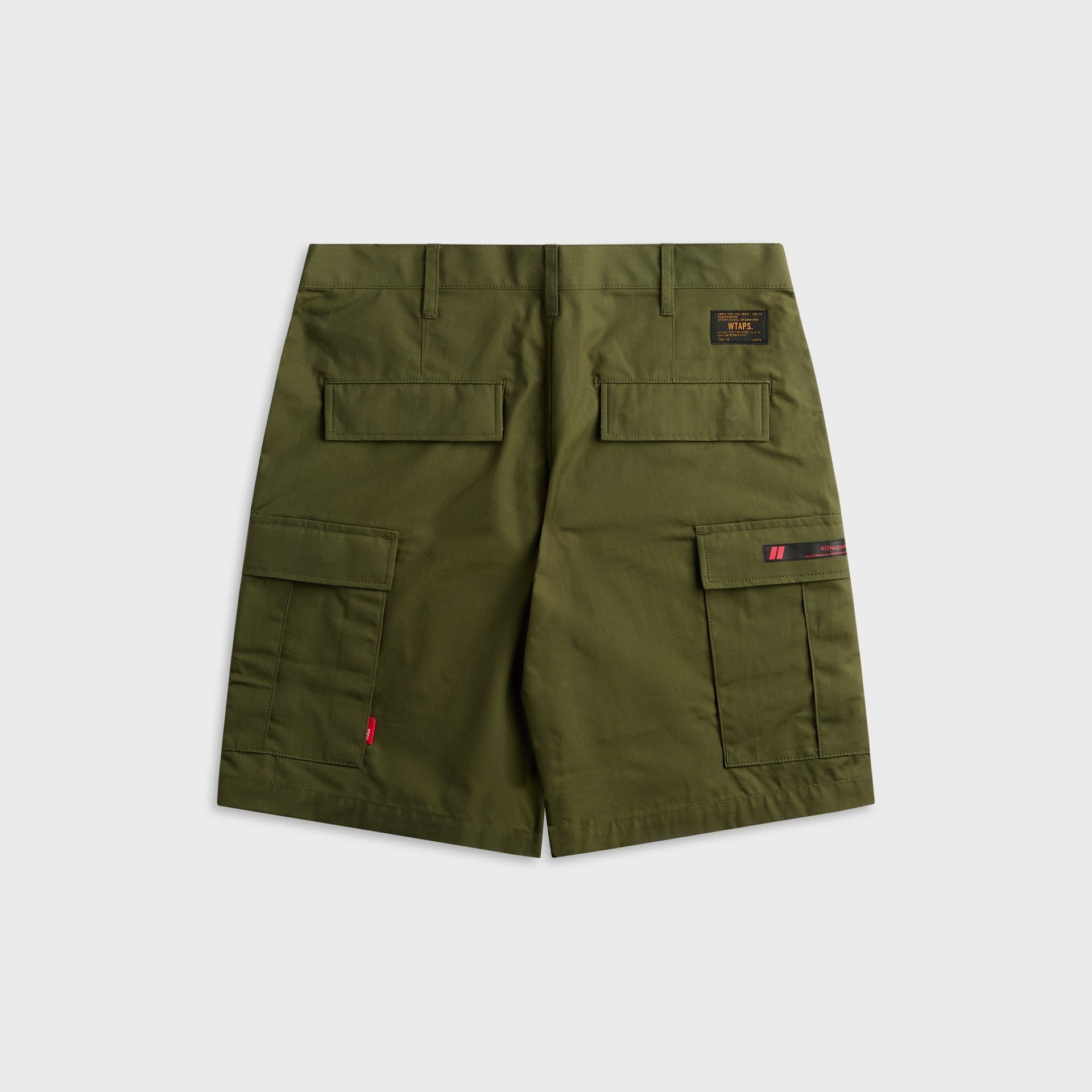 WTAPS MILS9601 olive drab cotton ripstop cargo short, back view with flap pockets, flat lay
