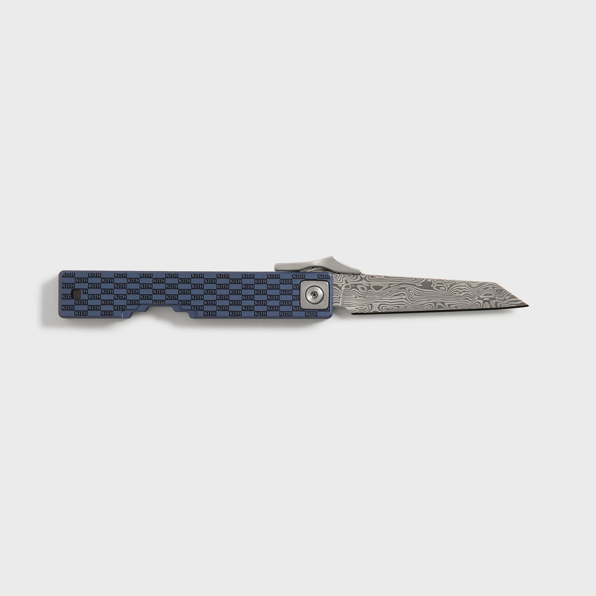 Kith x Benchmade Yamori folding knife open, reverse side view of the damascus blade and navy engraved handle, Nocturnal colorway
