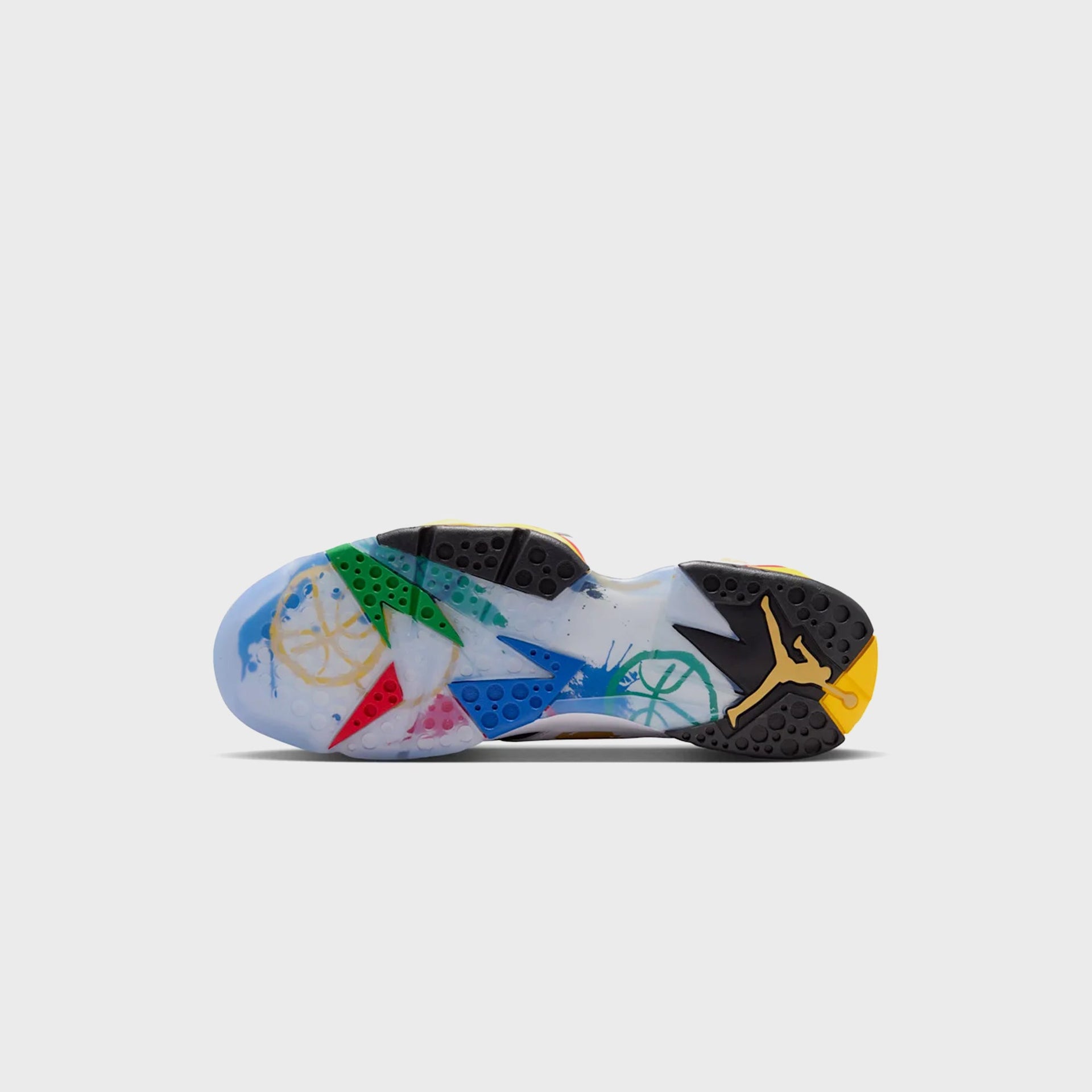 Outsole view of the Air Jordan 7 Retro showing the translucent icy sole with painterly multicolor graphics and gold Jumpman