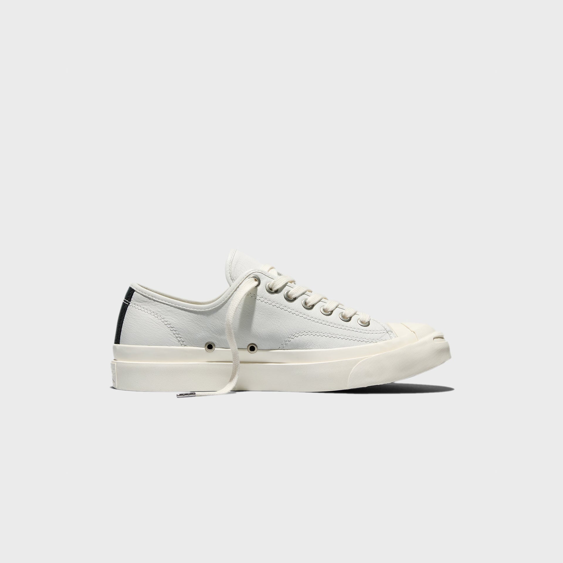 Converse Jack Purcell Premium white leather sneaker with black heel tab, right side profile view