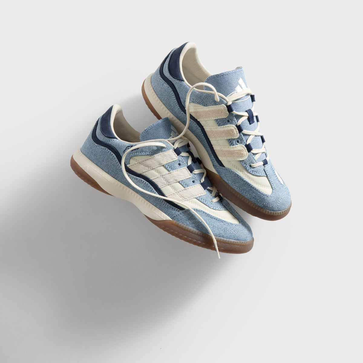 Kith for adidas Football Supernova Indoor in Denim/Gum, overhead angled view of the denim pair with cream laces