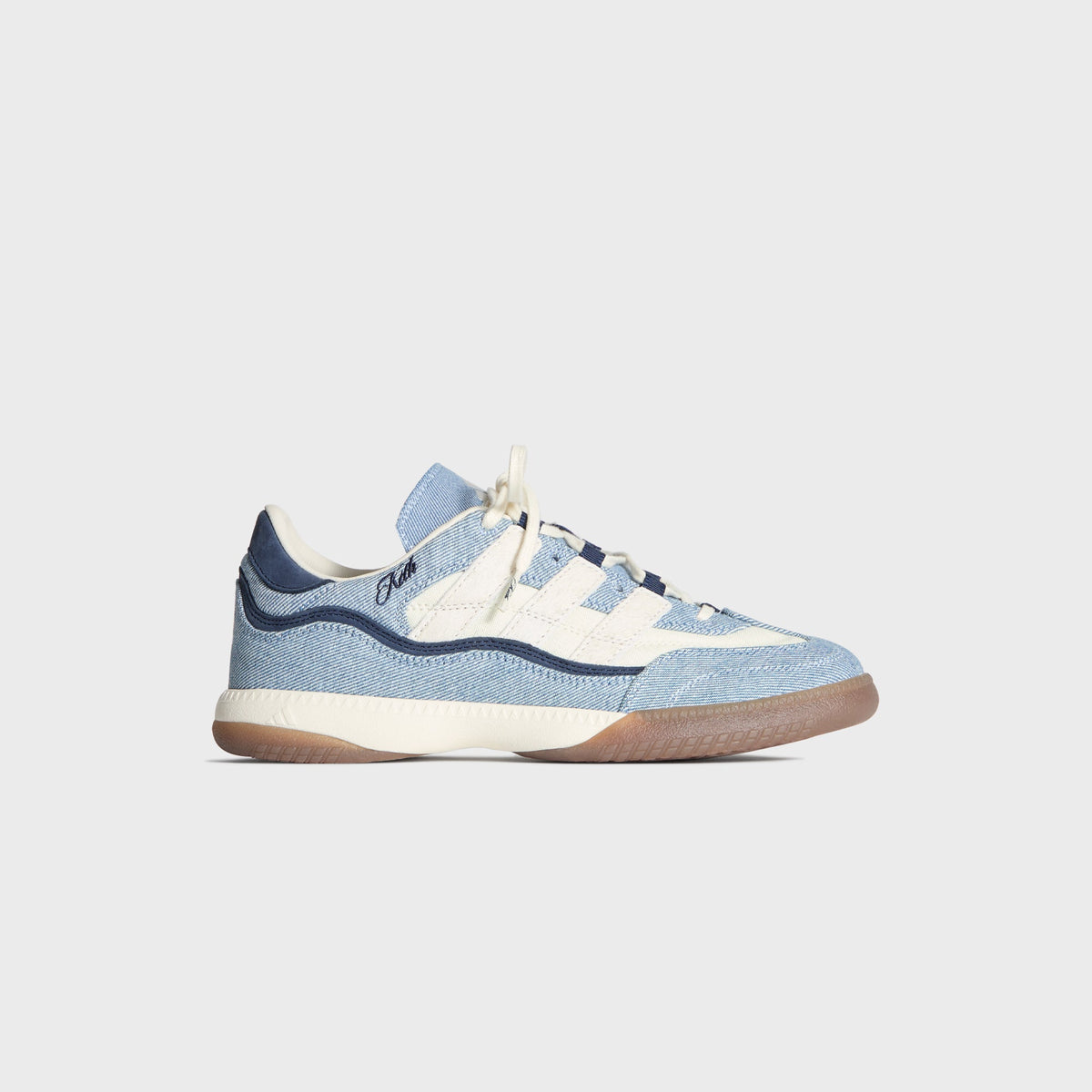 Kith for adidas Football Supernova Indoor in Denim/Gum, lateral profile of the right shoe with cream three stripes, navy heel and gum sole