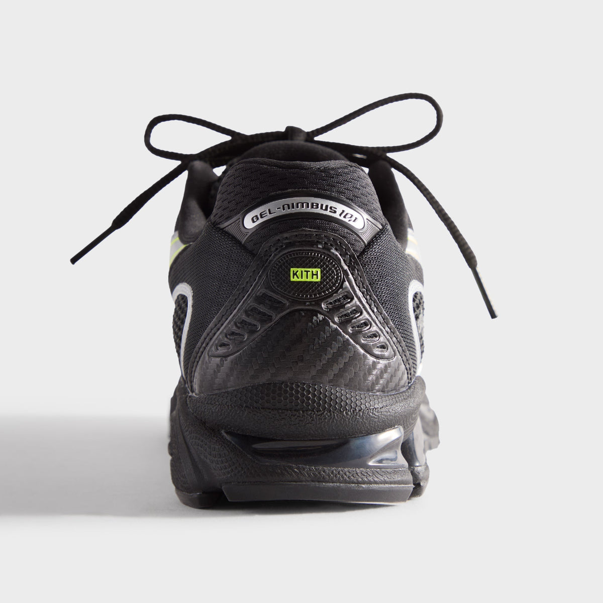 Kith for ASICS GEL-NIMBUS 10.1 black and silver, heel view with carbon-look counter, lime KITH tag and GEL-NIMBUS badge