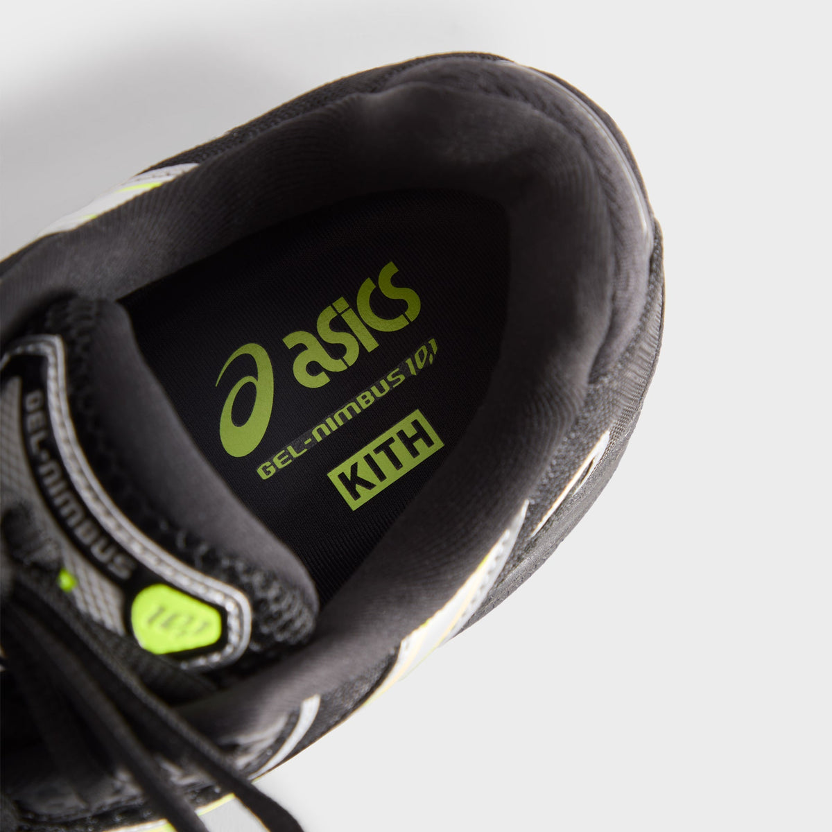 Kith for ASICS GEL-NIMBUS 10.1 black and silver, inside view of insole printed with lime ASICS, GEL-NIMBUS and KITH logos