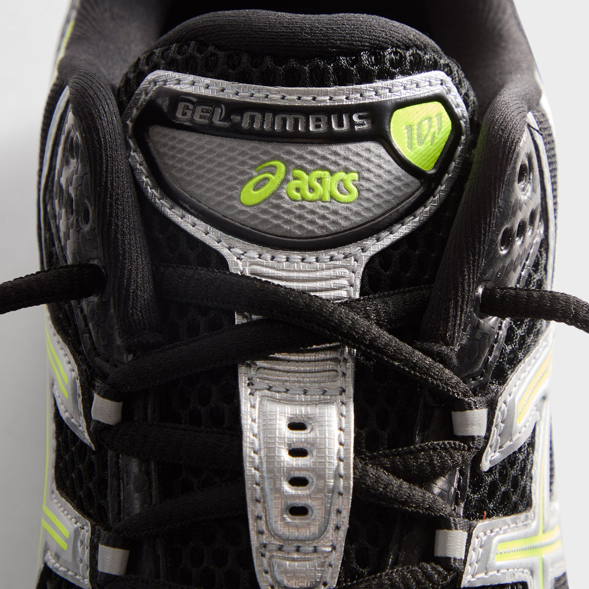 Kith for ASICS GEL-NIMBUS 10.1 black and silver, close-up of tongue with GEL-NIMBUS 10.1 label and lime ASICS logo
