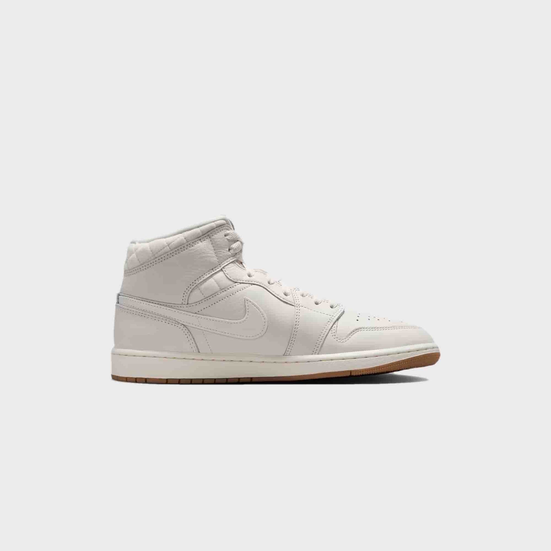 Air Jordan 1 Mid SE in Phantom, gum and University Red, lateral profile of the right sneaker on white