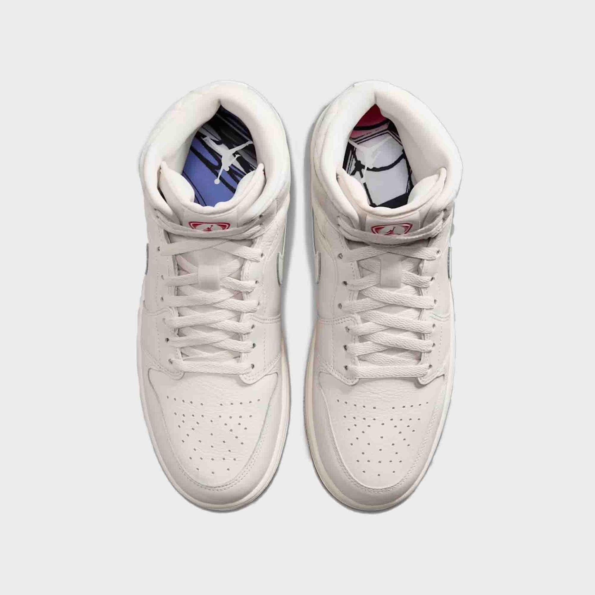 Air Jordan 1 Mid SE pair from above with printed insoles — blue Jumpman and comic-style graphics