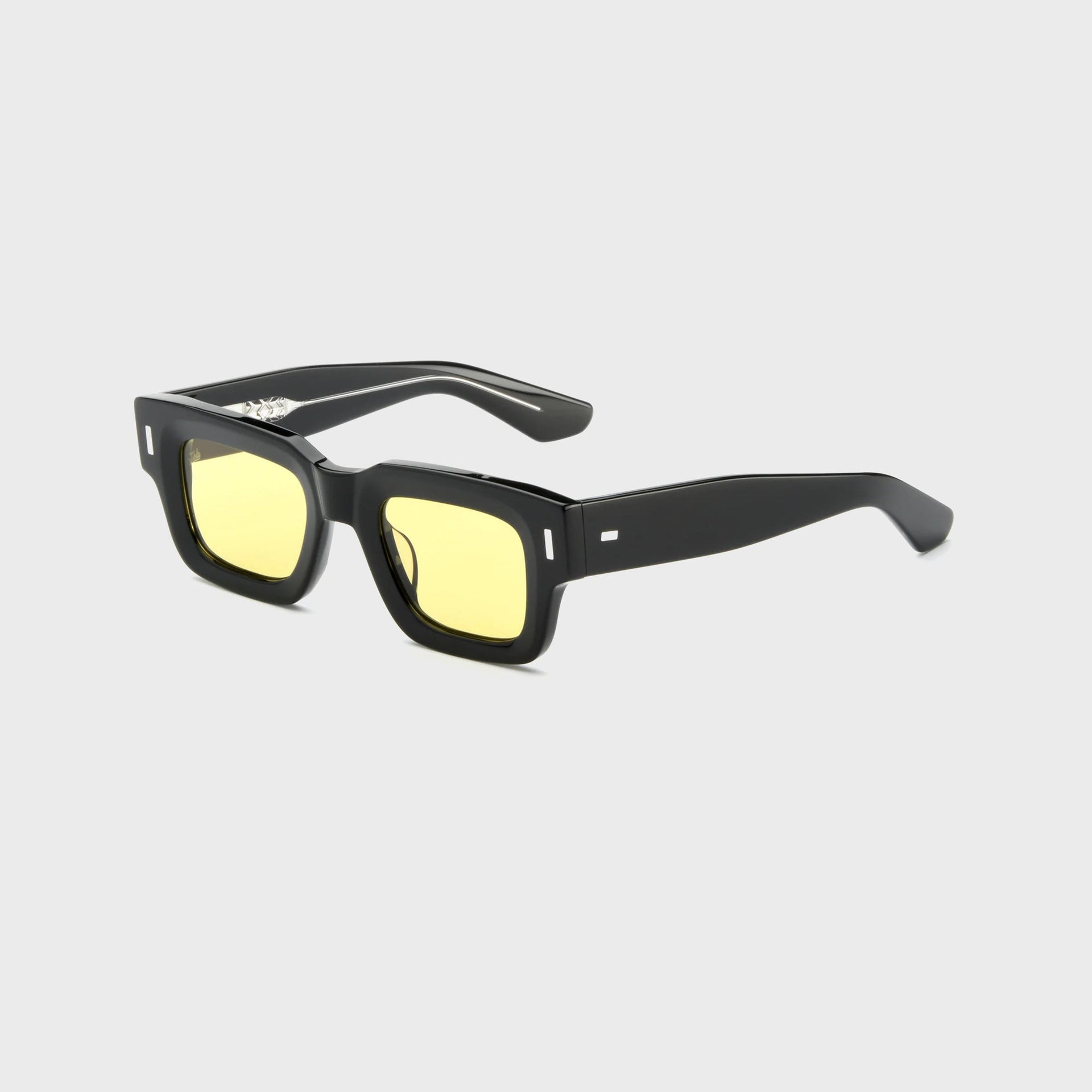 AKILA Ares sunglasses, 3/4 angle view, black square acetate frame, yellow lenses and thick temples