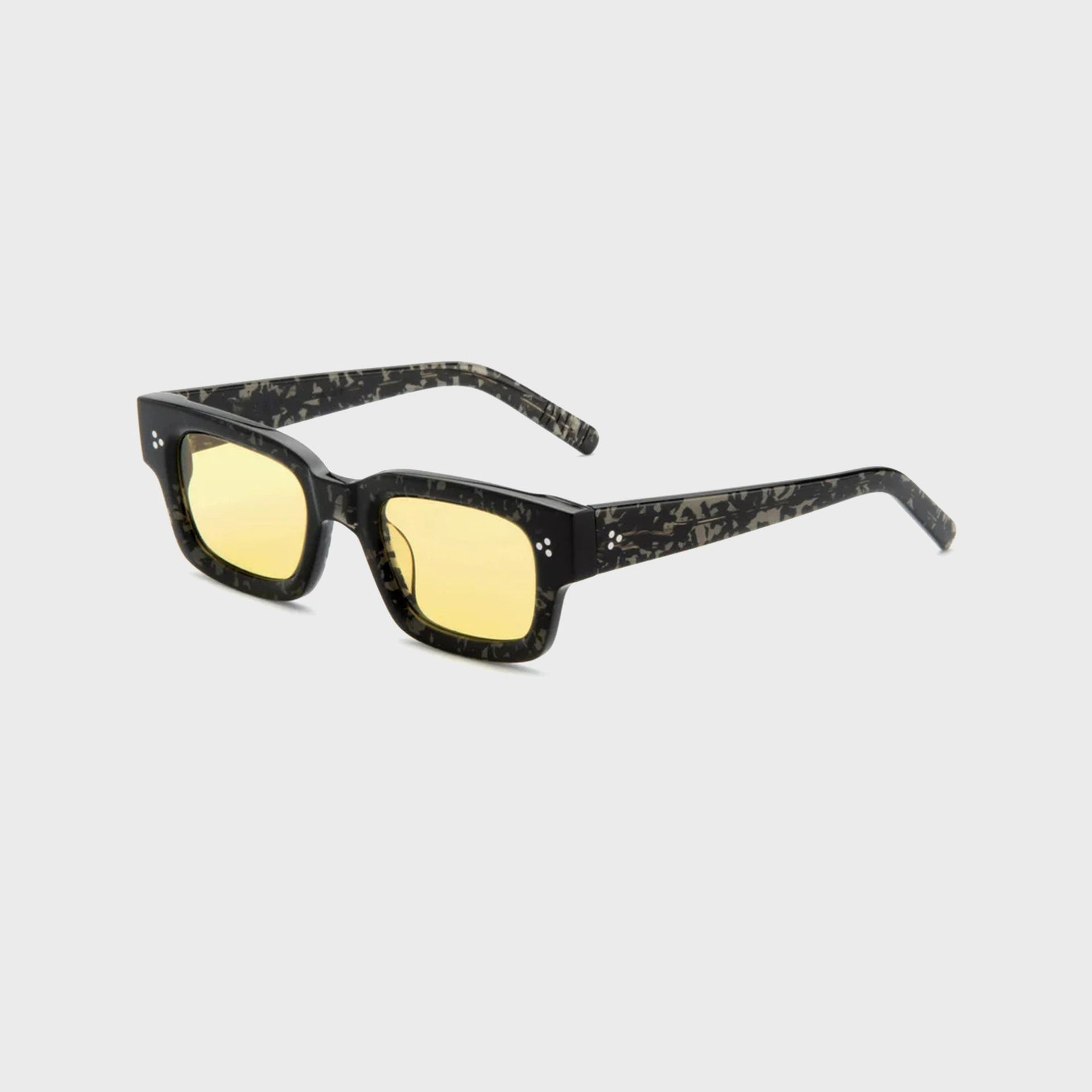 AKILA Syndicate sunglasses, 3/4 angle view, mottled black tortoise frame, yellow lenses and thick temples