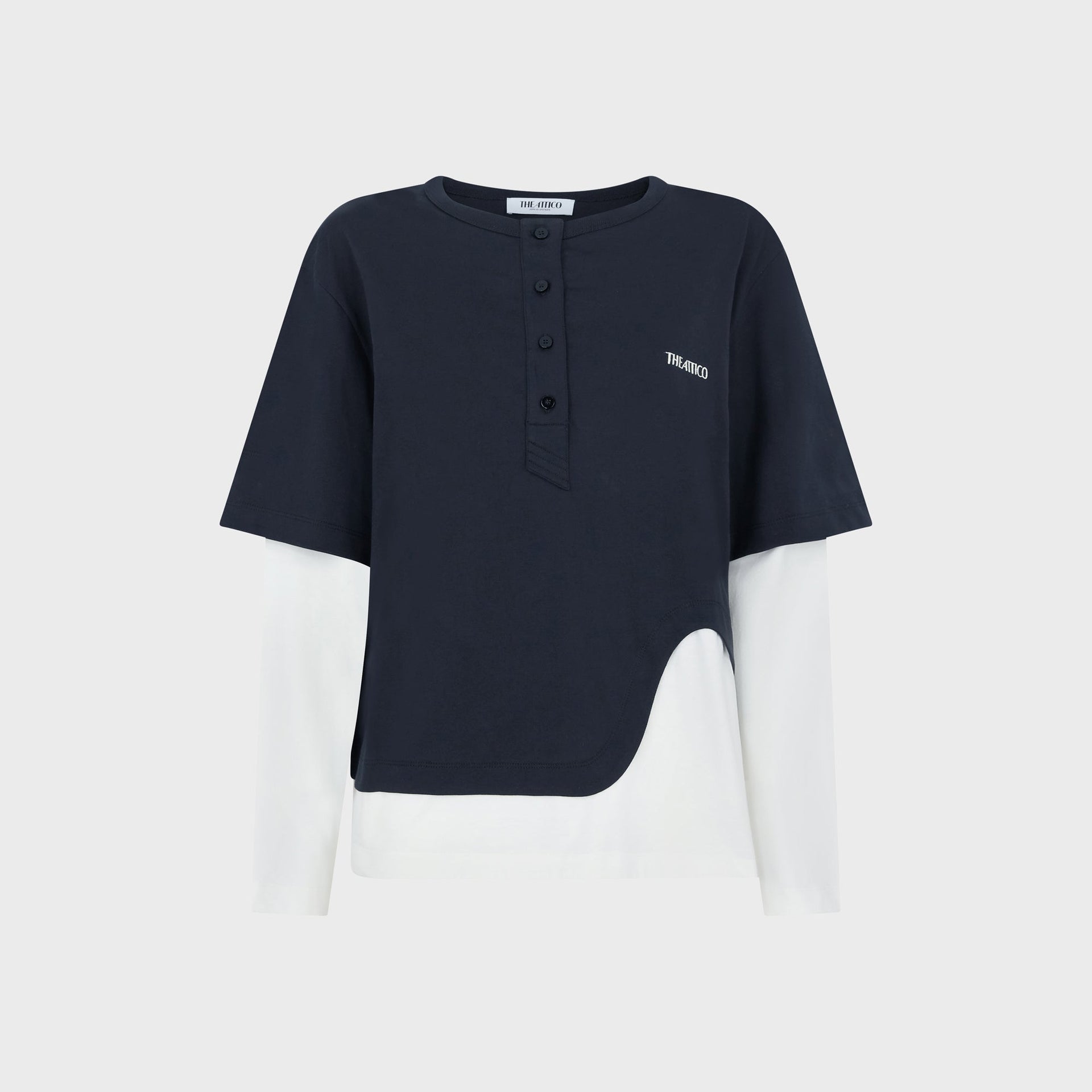 The Attico Layered Tee, navy henley short-sleeve over white long-sleeve, asymmetric hem, front flat-lay