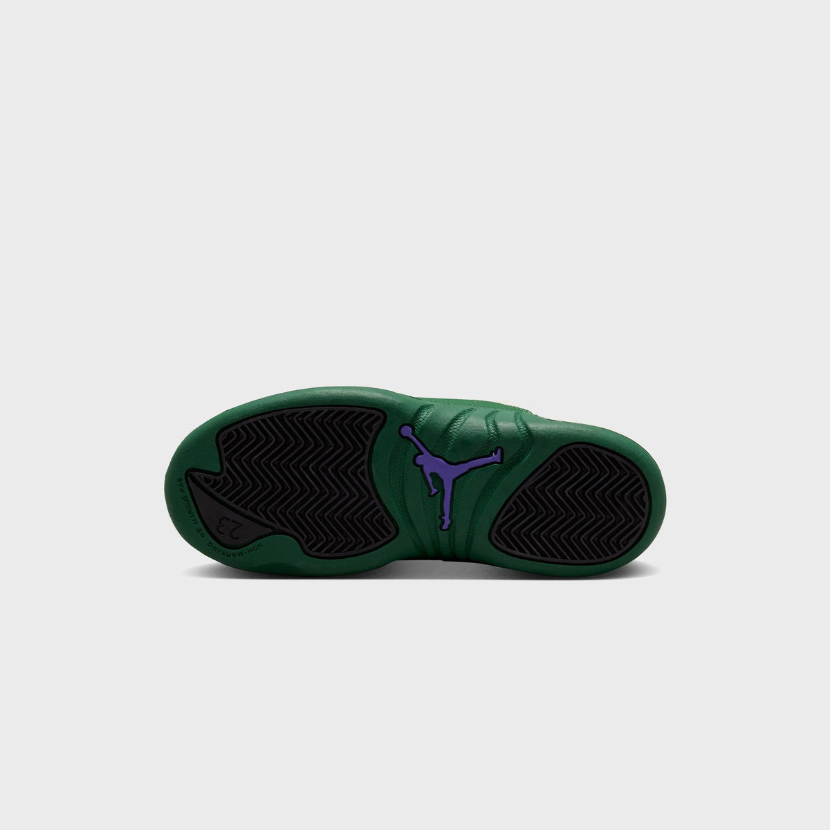 Outsole view of Jordan PS Air Jordan 12 Retro preschool shoe showing Gorge Green rubber sole with purple Jumpman logo