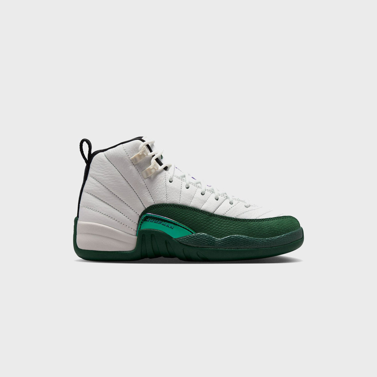 Jordan GS Air Jordan 12 Retro sneaker in Summit White pebbled leather with Gorge Green toe, kids sizing, lateral side view