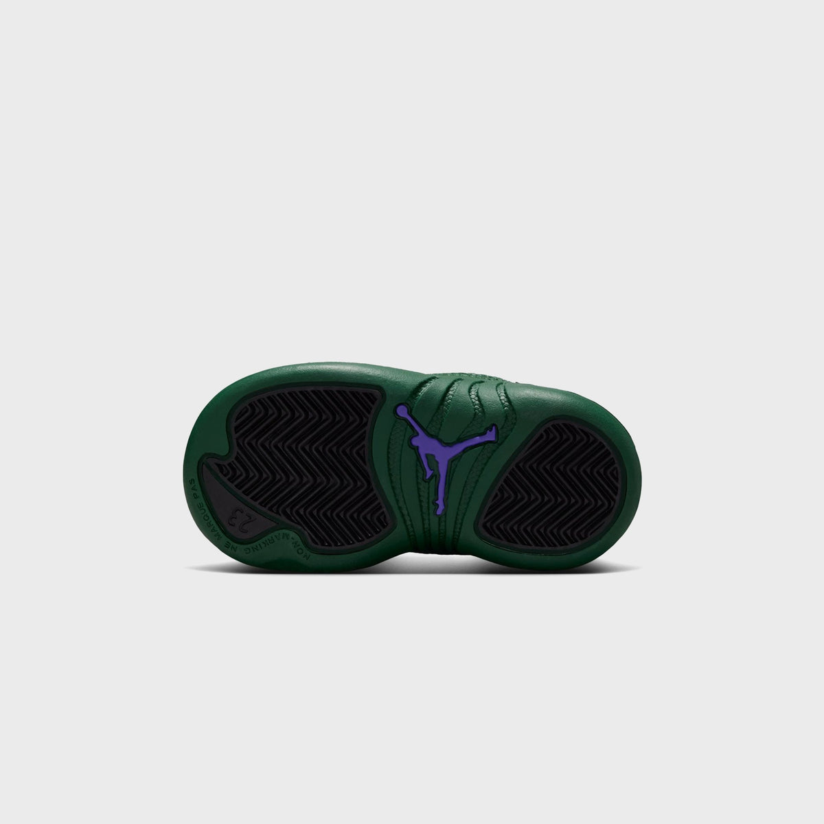 Outsole view of Jordan TD Air Jordan 12 Retro toddler shoe showing Gorge Green rubber sole with purple Jumpman logo