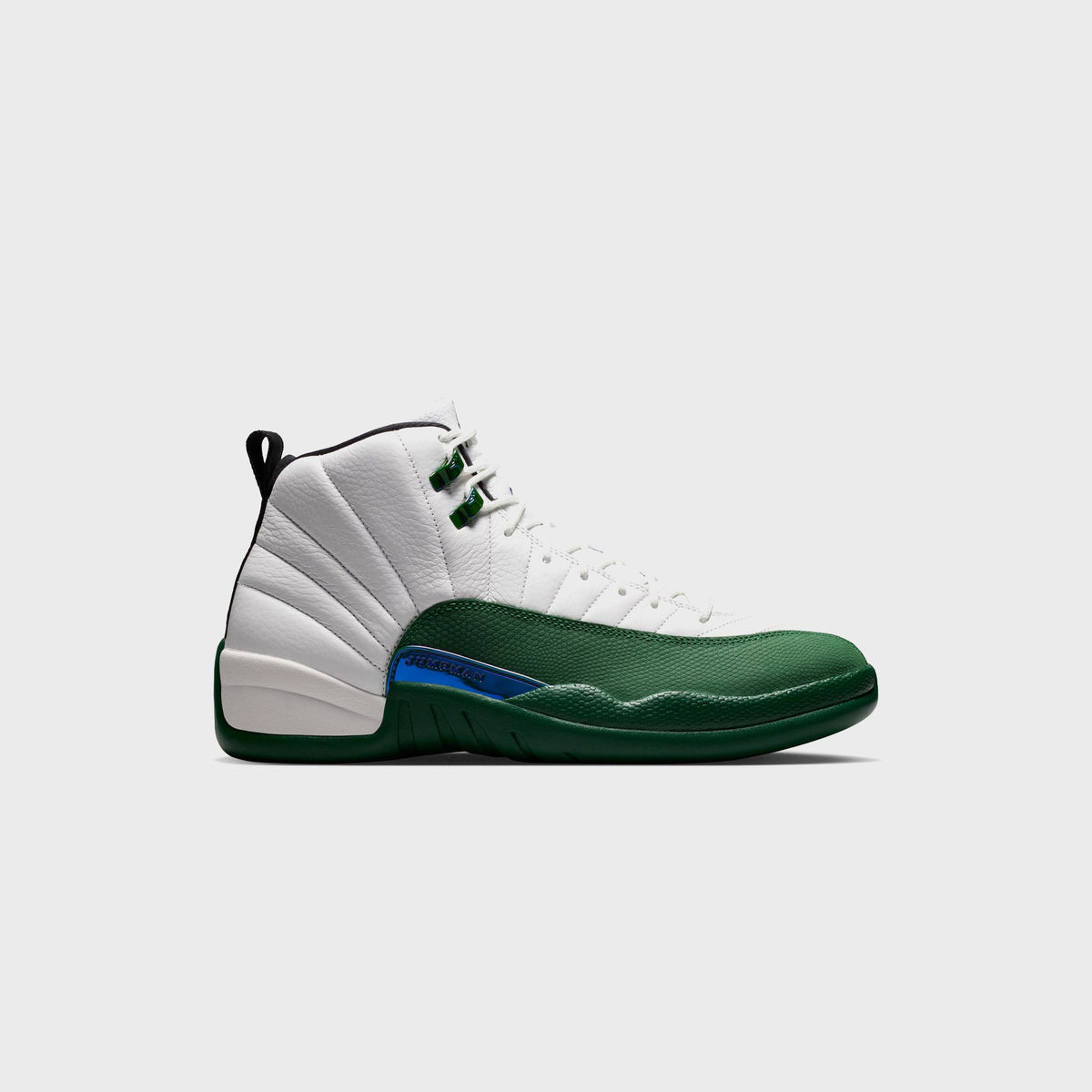 Air Jordan 12 Retro sneaker in Summit White pebbled leather with Gorge Green toe and black heel tab, lateral side view