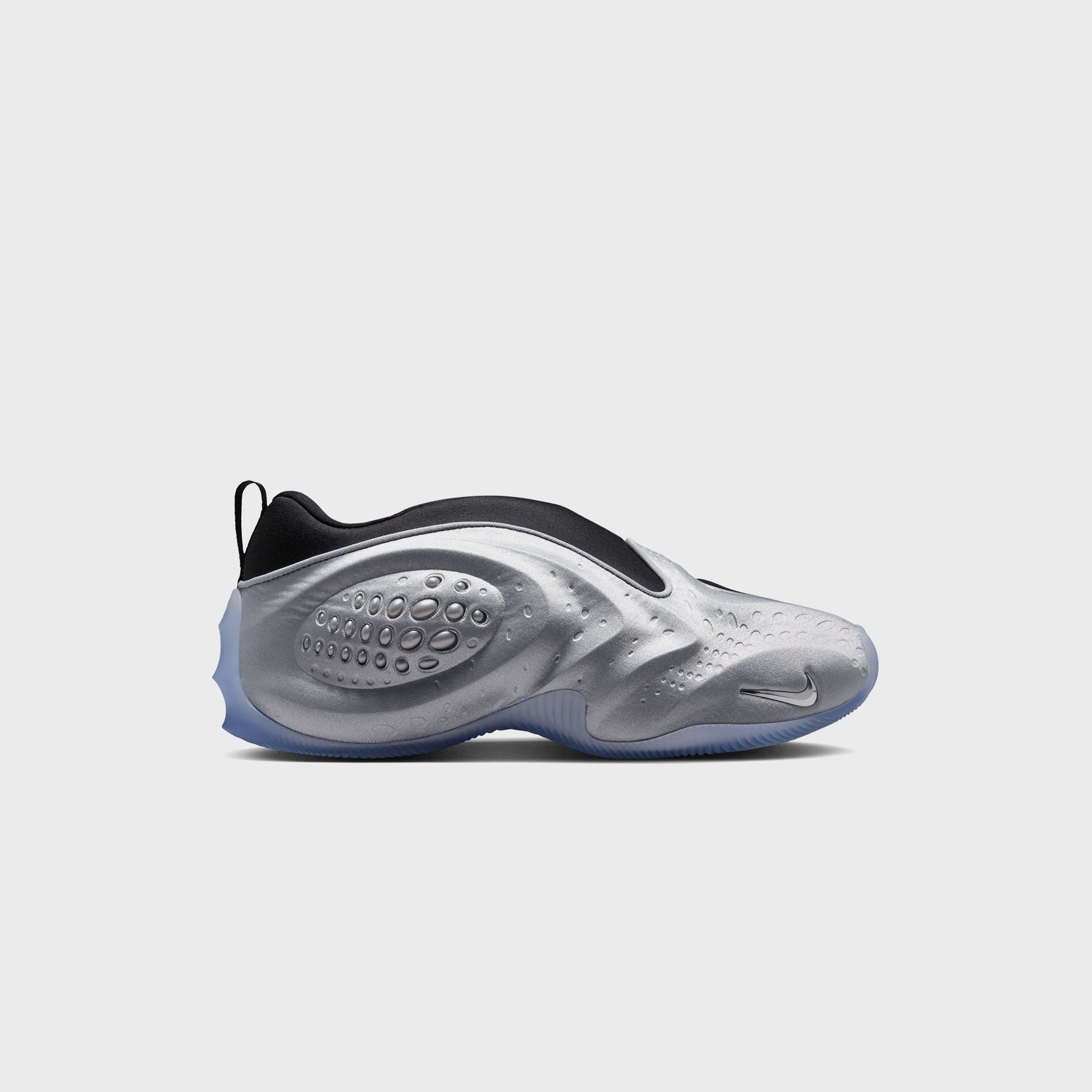 Nike WMNS First Sight Shadow Metallic Silver sneaker, lateral profile with silver bubble pod, black collar and icy translucent sole