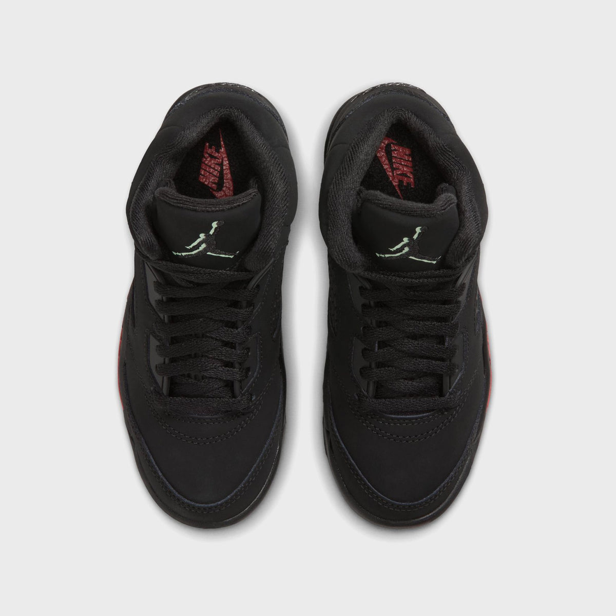 Top-down view of Jordan PS Jordan 5 Retro black nubuck showing laces and green Jumpman tongue detail
