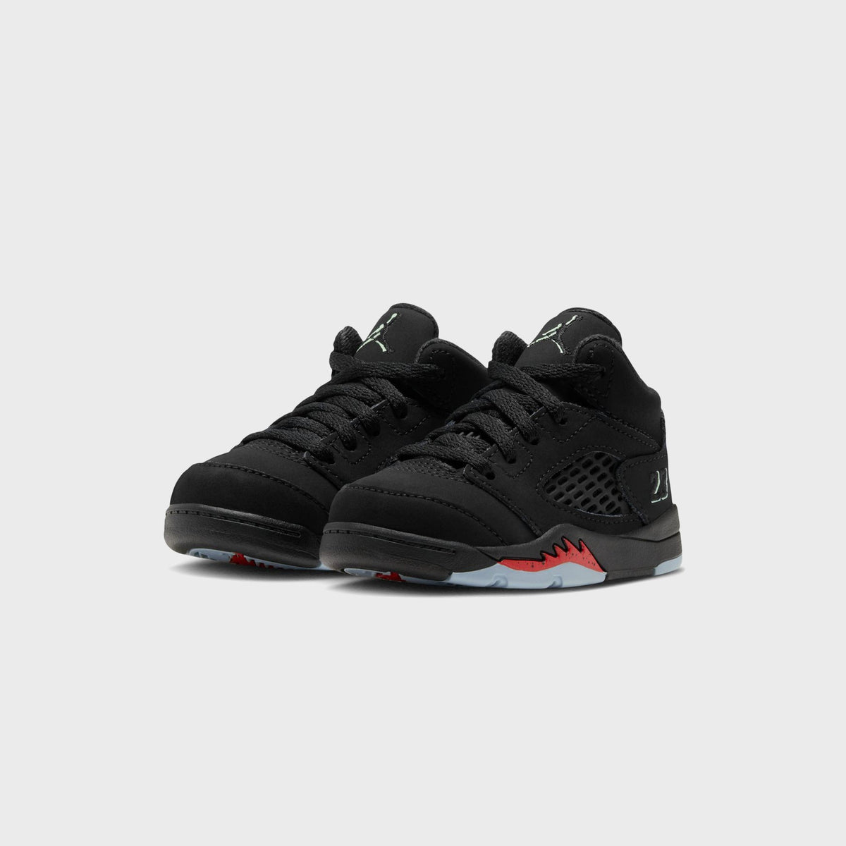 Pair of Jordan TD Jordan 5 Retro black nubuck toddler sneakers, three-quarter front view with red flame midsole