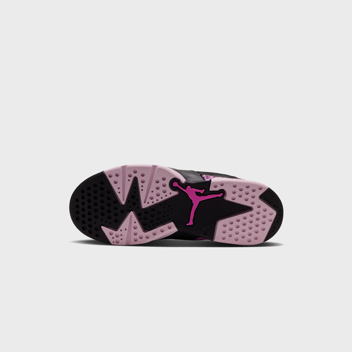 Outsole of Air Jordan 6 Retro Low PS with light pink and black rubber tread and pink Jumpman logo at center