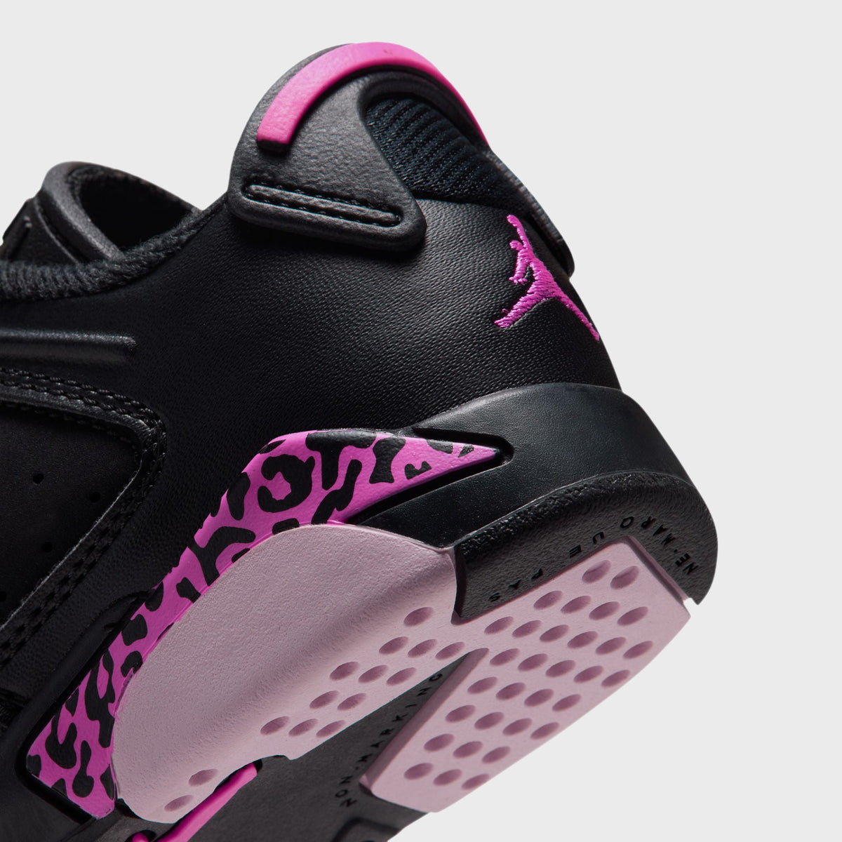 Close-up of Air Jordan 6 Retro Low PS heel in black with pink leopard-print panel, pink tab and light pink outsole