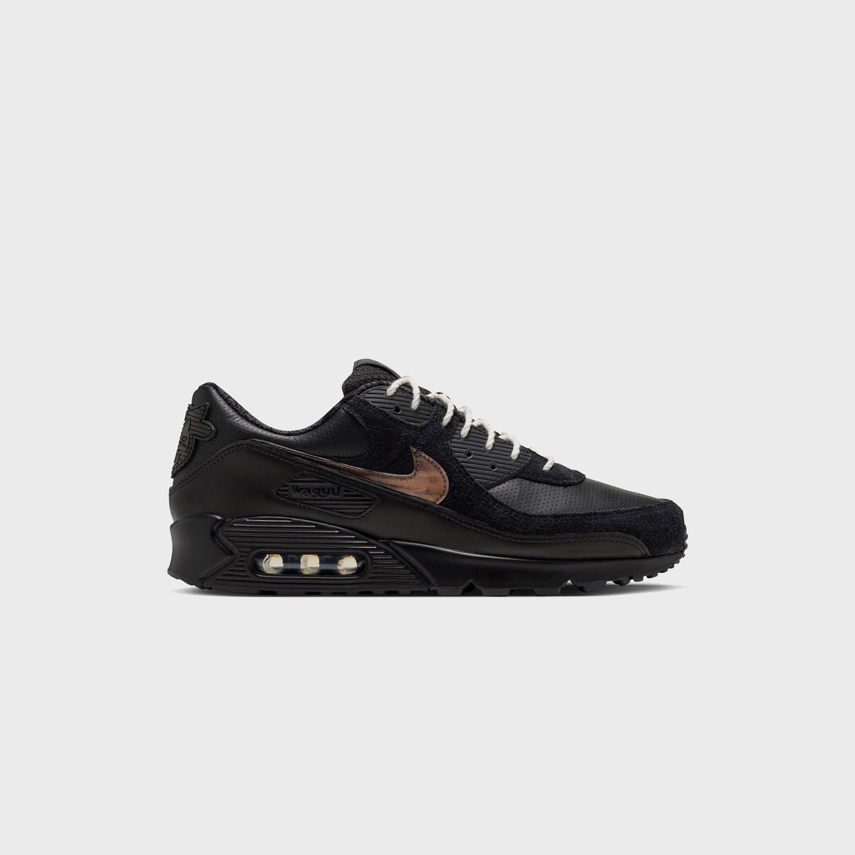 Nike x Wagyu Air Max 90 sneaker in all-black leather and suede with marbled amber swoosh, lateral side view