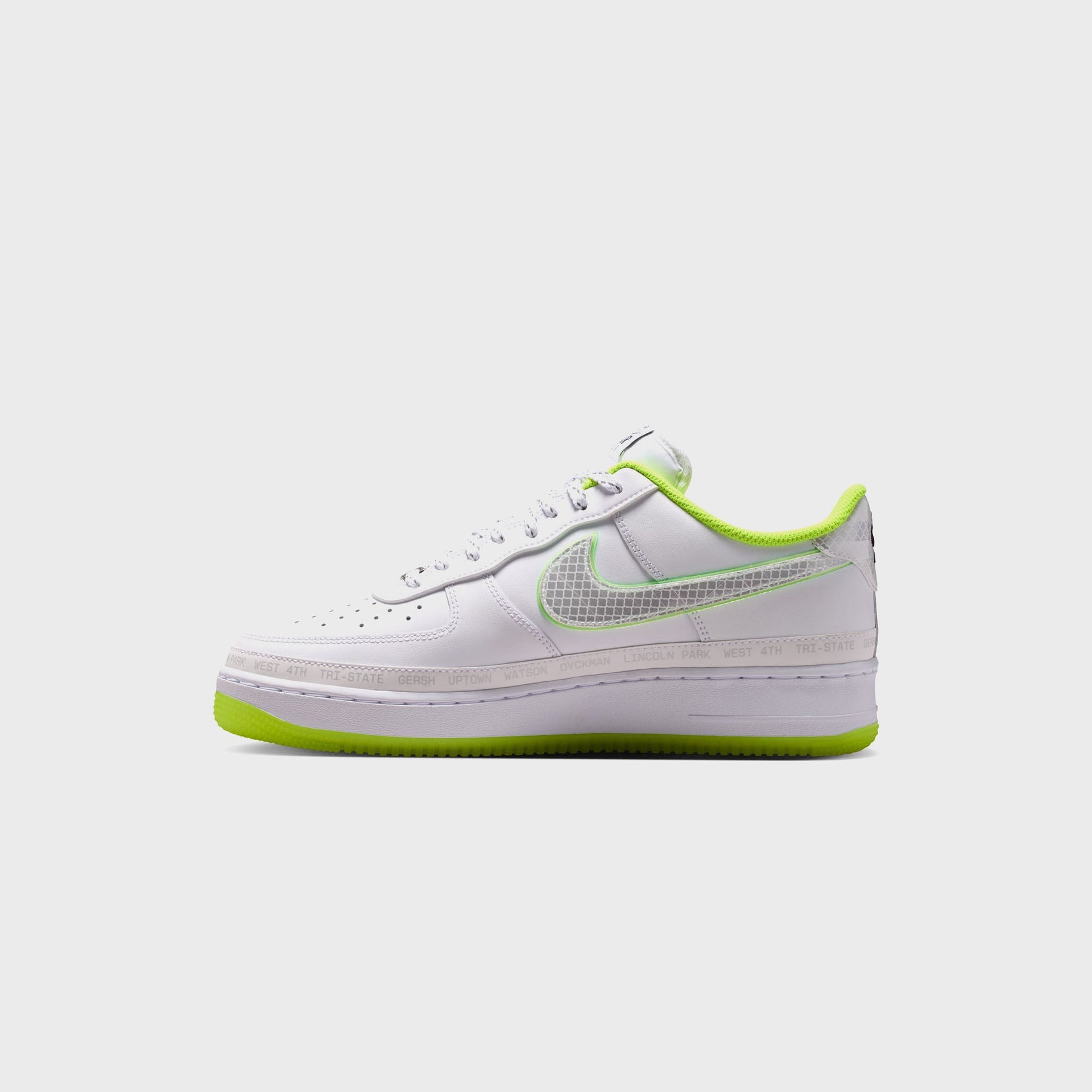 Nike Air Force 1 '07 white sneaker, medial side view with volt-lined collar, grid Swoosh and printed New York neighborhood midsole band