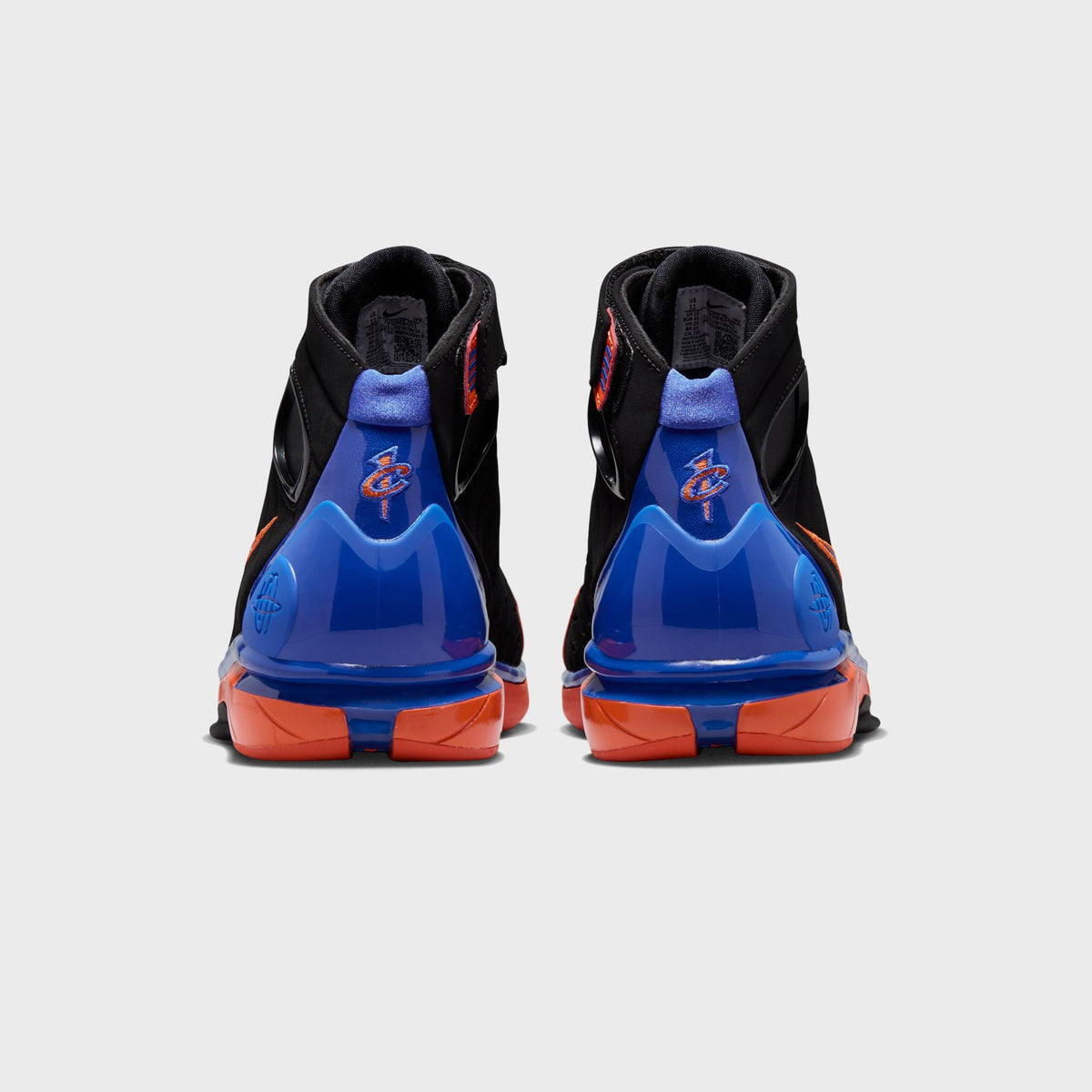 Nike Air Zoom Huarache 2K4 basketball shoes in Black, Varsity Royal, and Safety Orange, rear view showing the heel strap