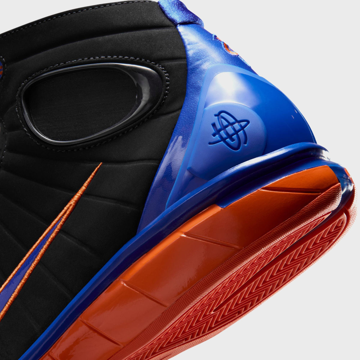 Nike Air Zoom Huarache 2K4 basketball shoe, close-up of the Varsity Royal heel counter with Huarache logo