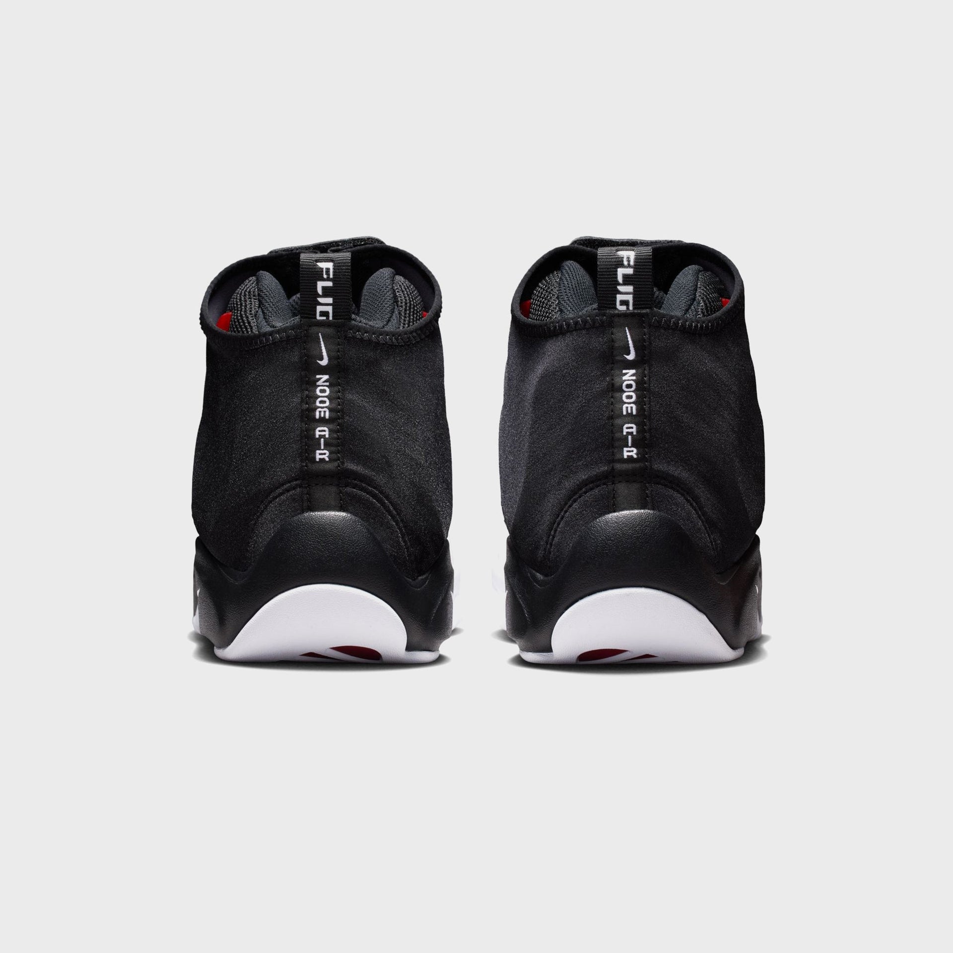 Nike Air Zoom Flight The Glove in black, back heel view showing white Flight Zoom Air branding on pull tabs