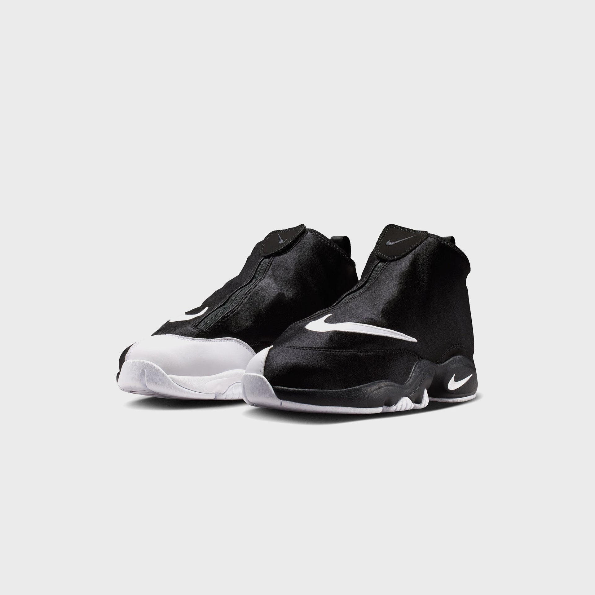 Nike Air Zoom Flight The Glove in black and white, front three-quarter view of pair with zip shroud over laces