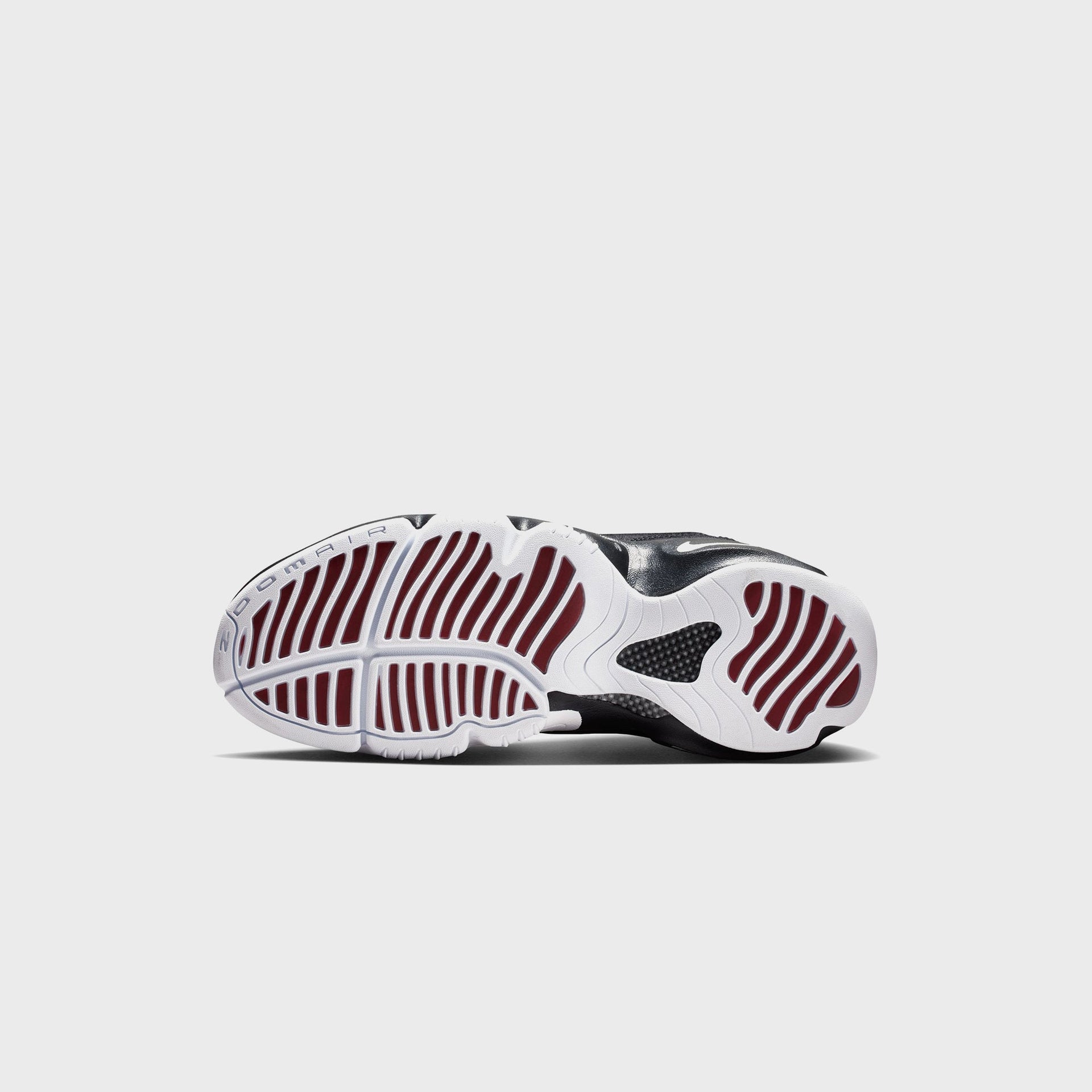 Nike Air Zoom Flight The Glove, bottom outsole view with white and burgundy tread and Zoom Air text