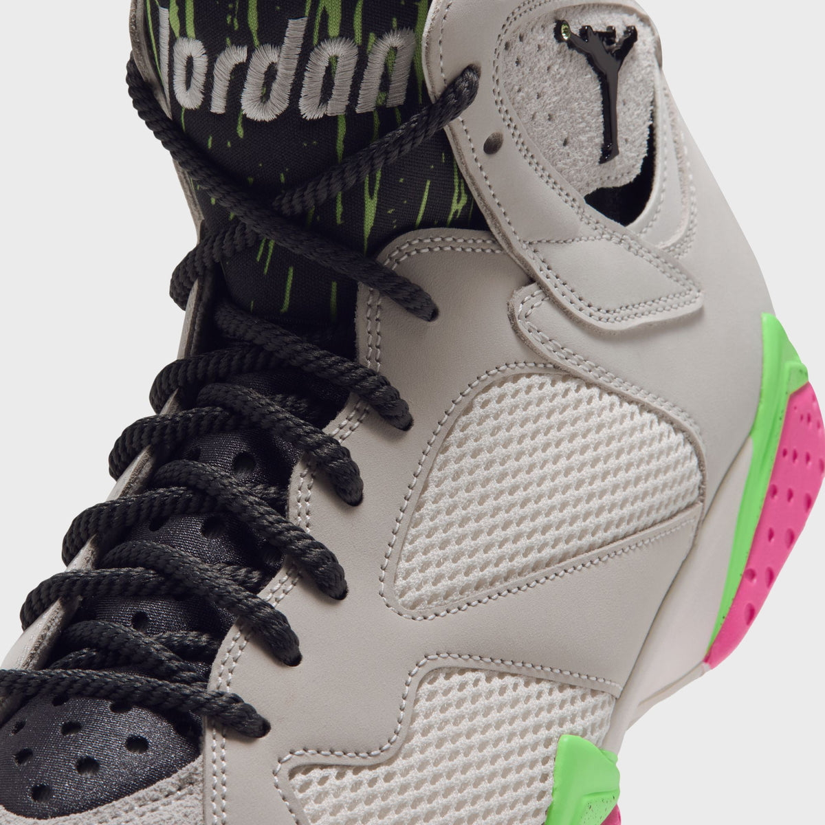Close-up of Air Jordan 7 tongue with Jumpman logo and Jordan wordmark on speckled lining