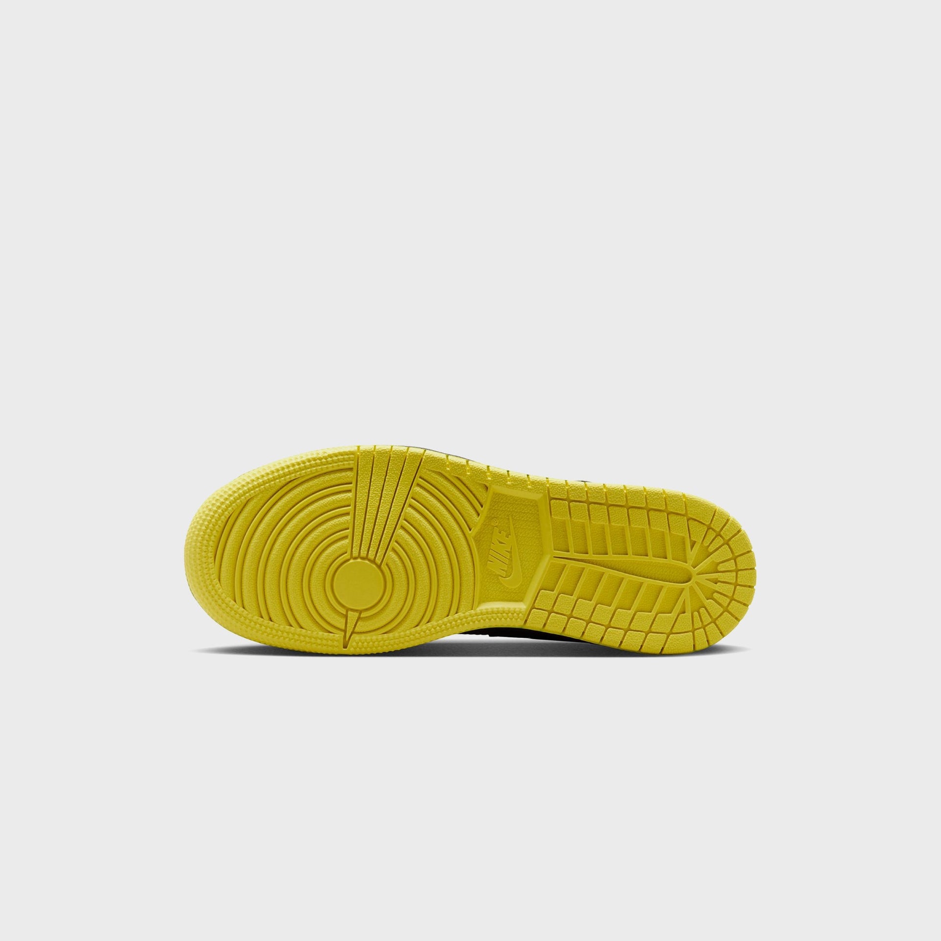 Air Jordan 1 Mid SE opti yellow rubber outsole with circular pivot tread pattern and Nike branding