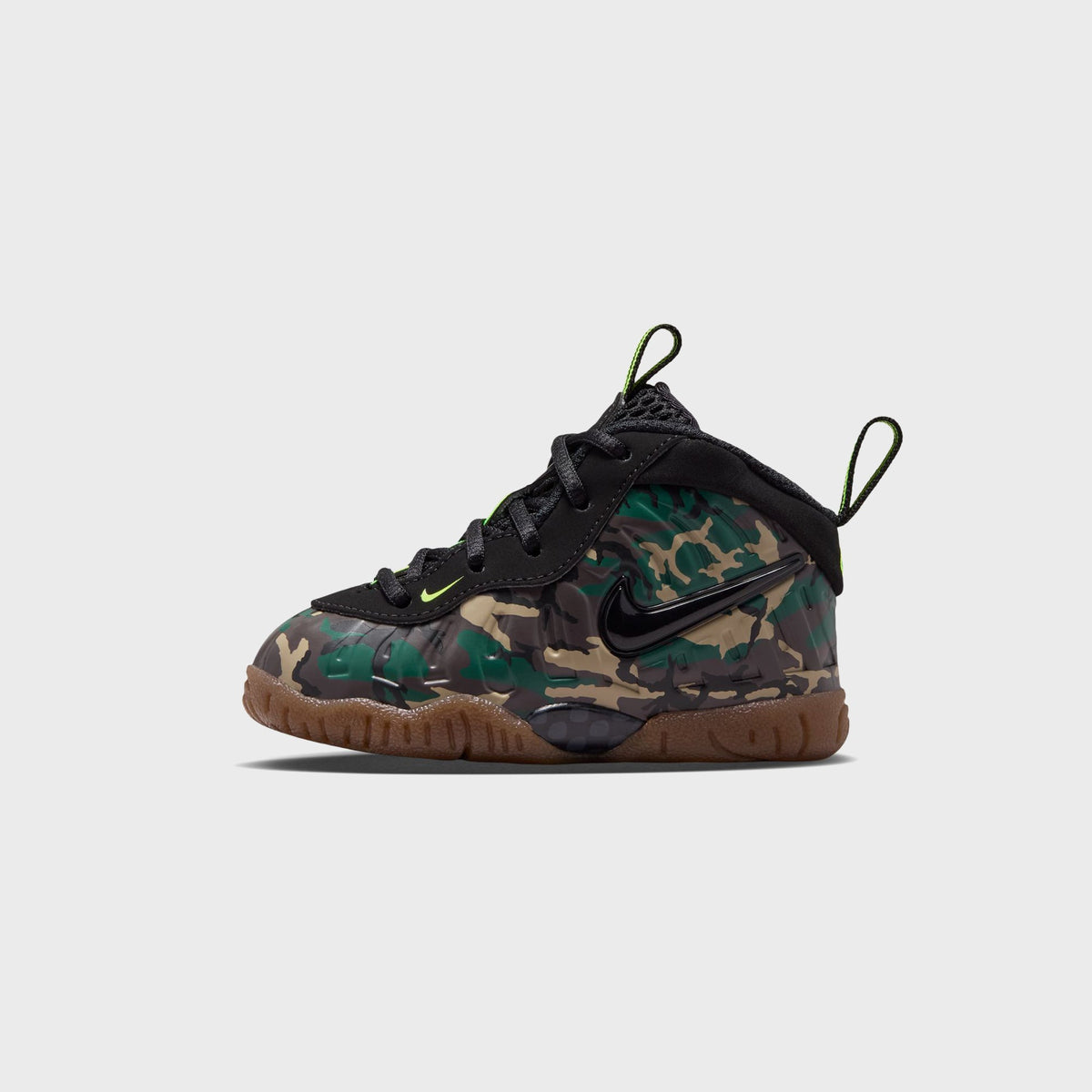 Pair of Nike TD Little Posite Pro toddler sneakers in camo and black, three-quarter angled view