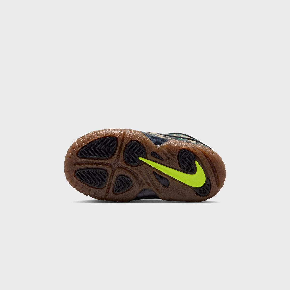 Gum outsole of Nike TD Little Posite Pro toddler sneaker, angled view showing tread pattern