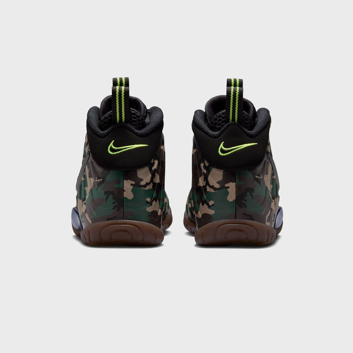 Heel view of Nike GS Little Posite Pro sneakers with volt green embroidered Swoosh