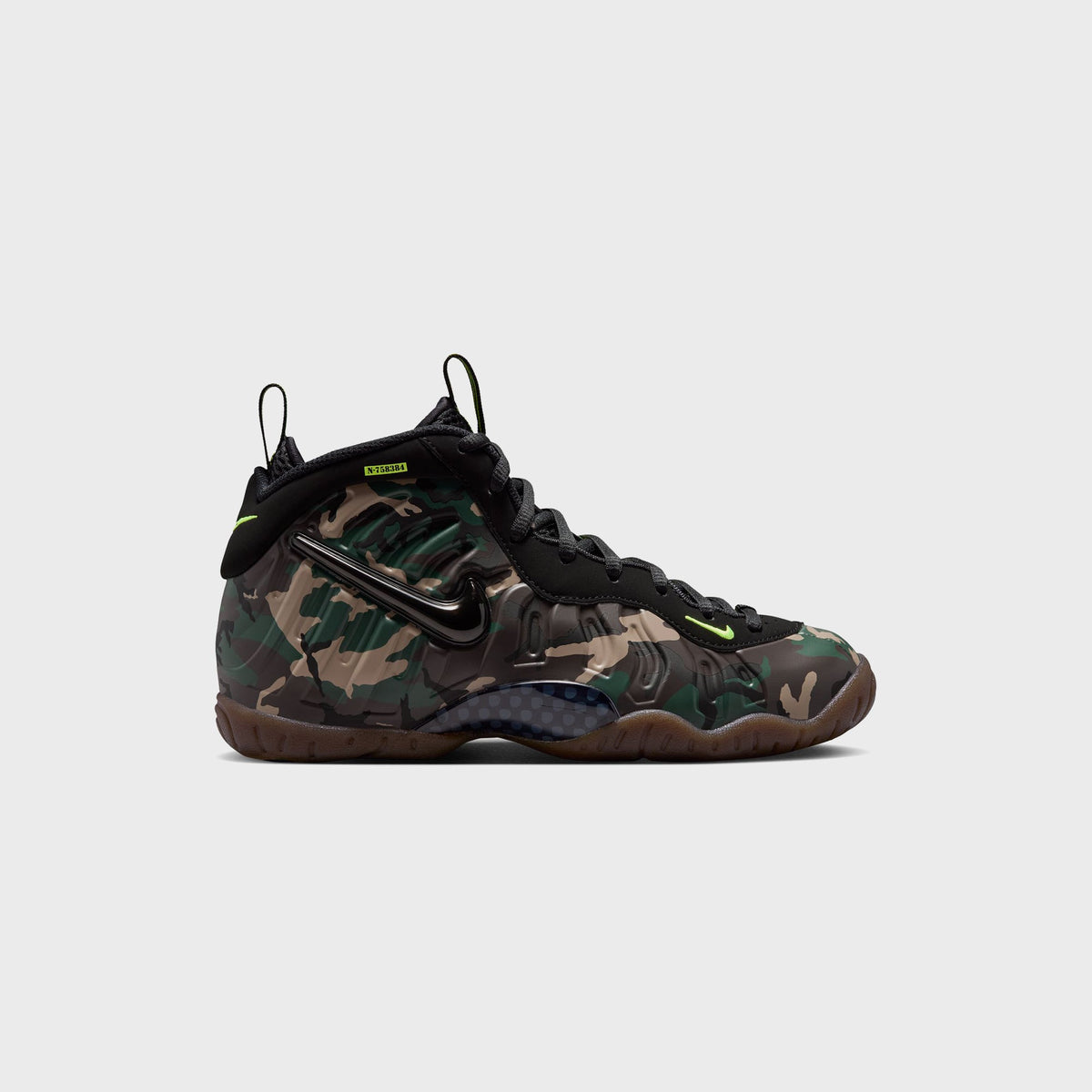 Nike GS Little Posite Pro grade-school sneaker in green camo with black laced upper, volt accents and gum sole
