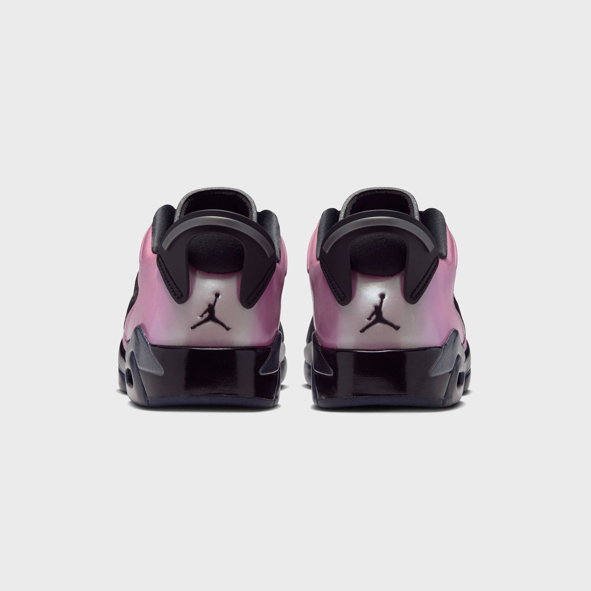 Jordan WMNS Air Jordan 6 Low in Black / Desert Berry, back view of the sneaker pair showing the Jumpman logo