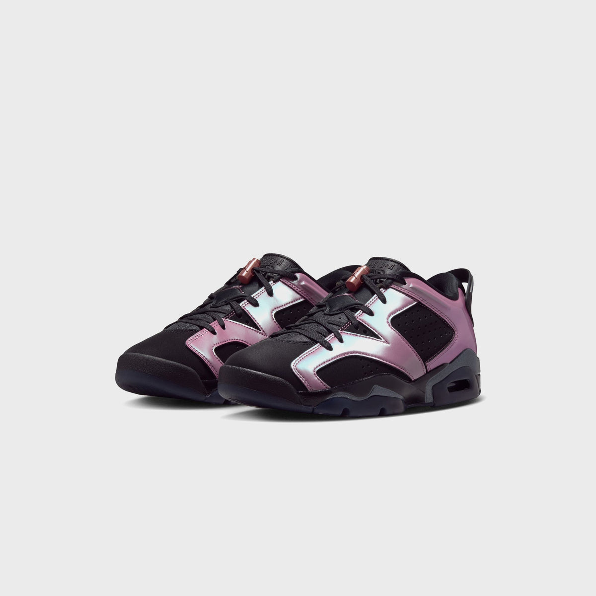 Jordan WMNS Air Jordan 6 Low in Black / Desert Berry, pair of black and pink low-top sneakers, angled side view