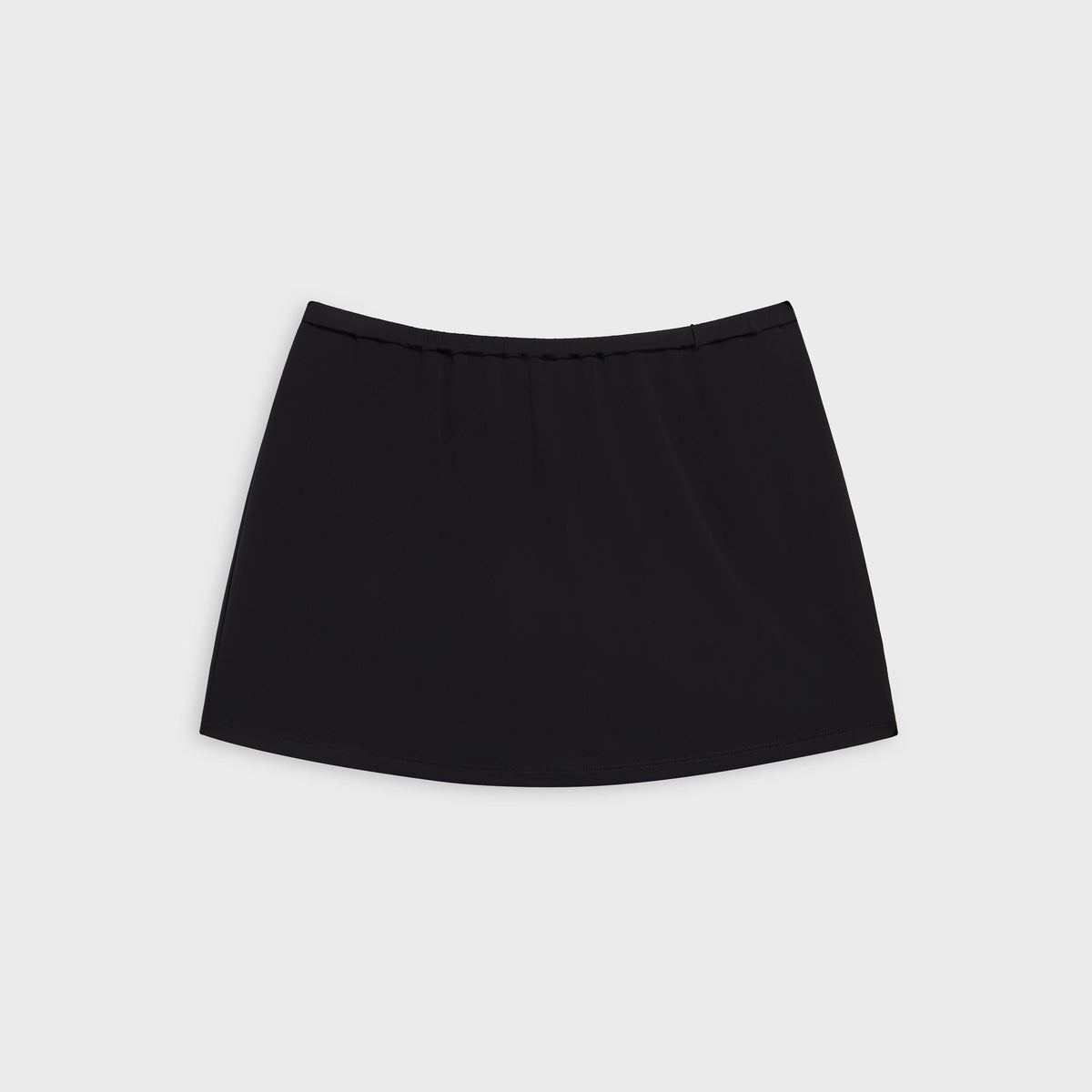 Alexander Wang black mid rise mini skort with elastic waistband, flat lay front view