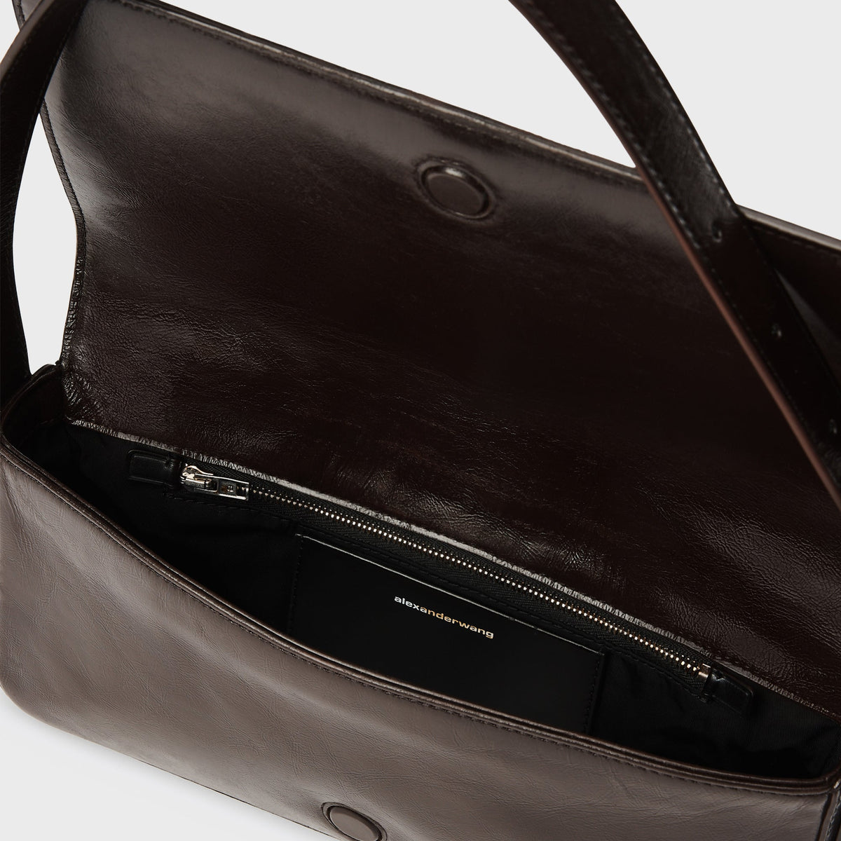 Alexander Wang Punch Flap Shoulder Bag in Oxblood, open view showing the dark brown leather interior and zip pocket