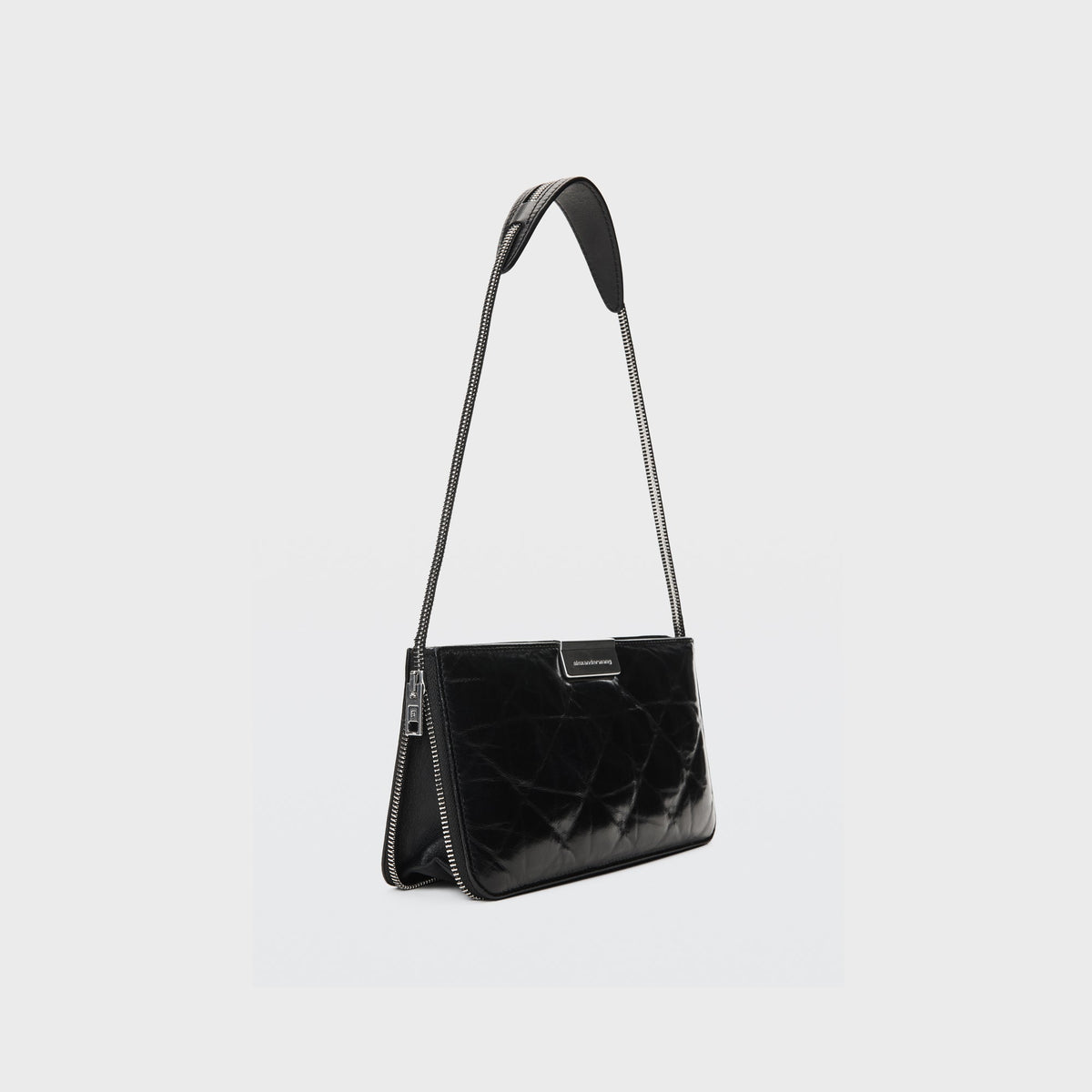 Alexander Wang Siren pressed quilted mini bag in black leather, side angle showing chain strap and zip pull