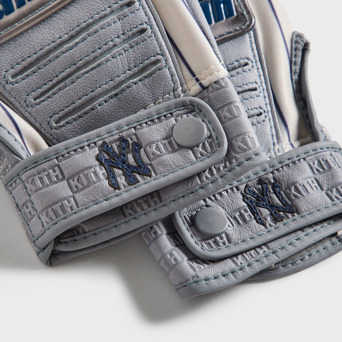 Kith & Franklin CFX Pro batting gloves - close-up detail of wrist strap snap with embroidered NY logo
